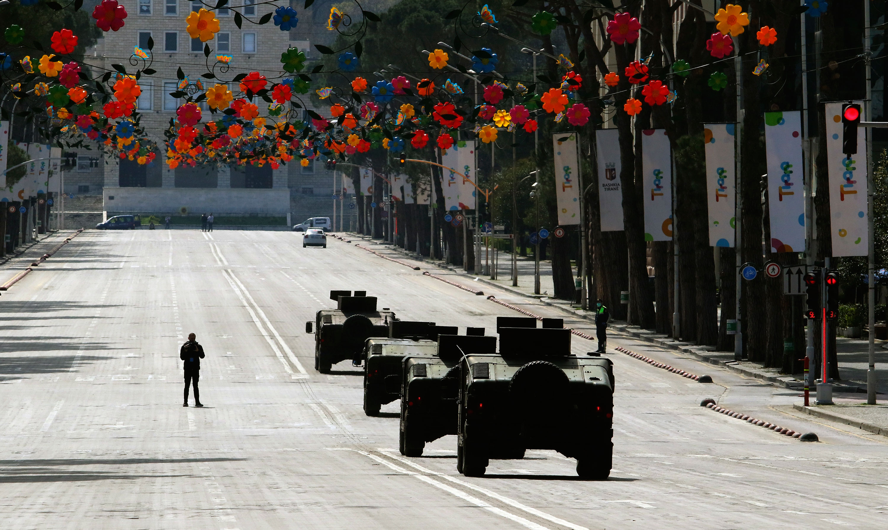 Military vehicles patrol the streets of Tirana, Albania on March 22.