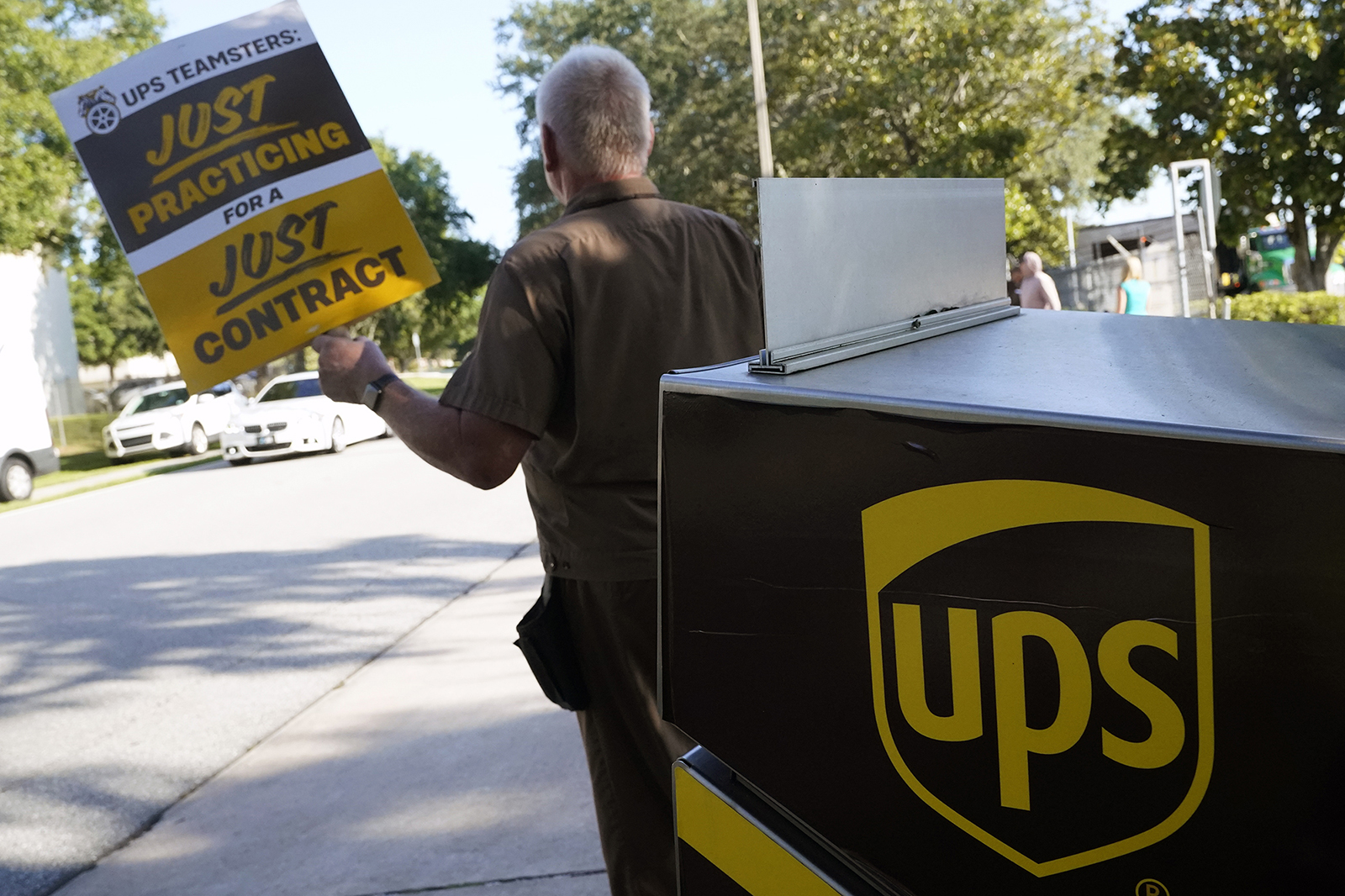 UPS workers go through a rehearsal of a pending strike at the UPS Customer Center on July 13 in Longwood, FL.