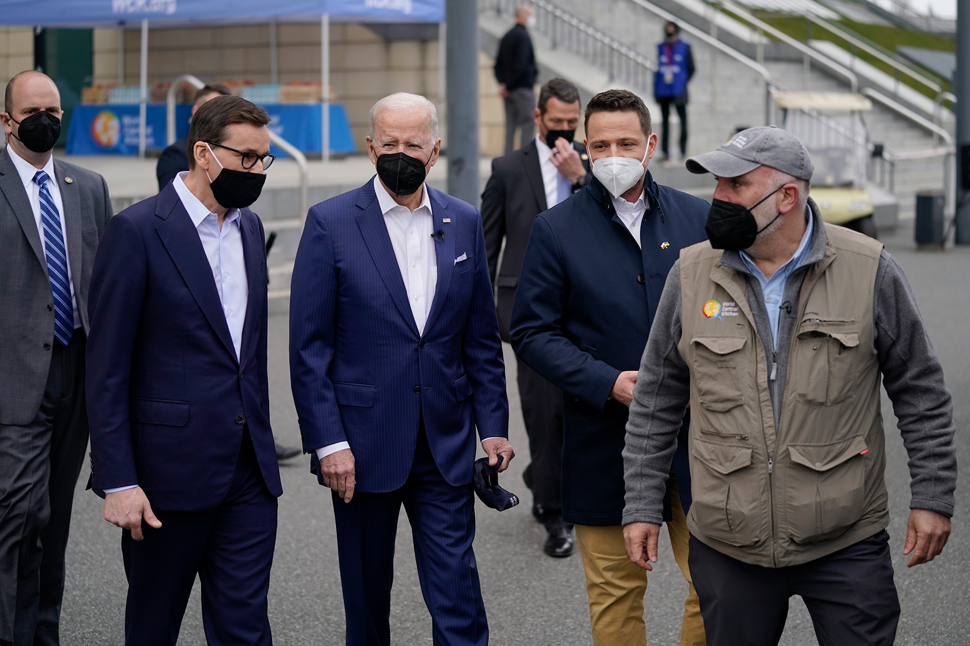 US President Joe Biden meets with chef José Andrés, far right, at a World Center Kitchen food distribution site in Warsaw, Poland on March 26.