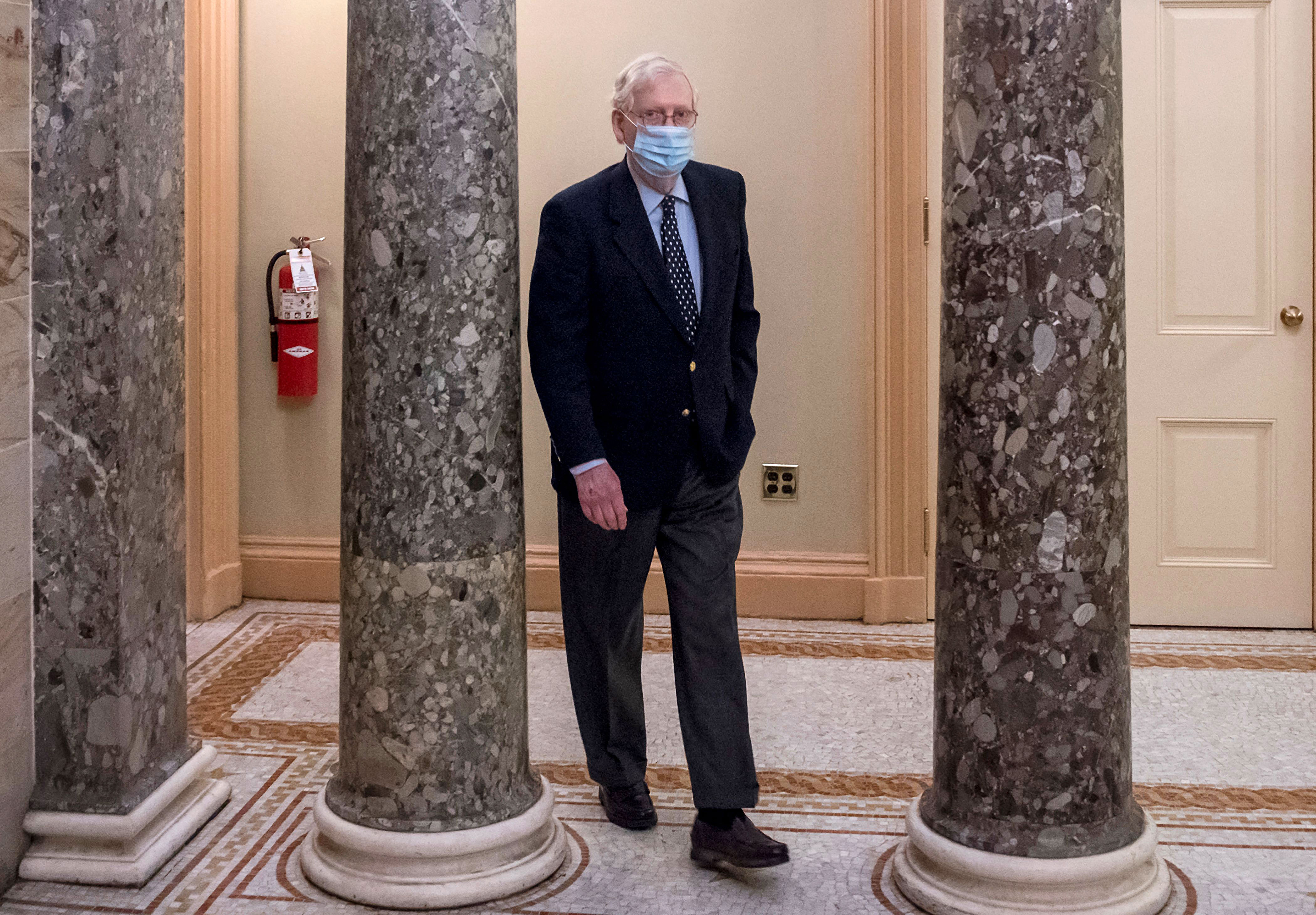 Mitch McConnell, US Senate majority leader, walks from his office to the Senate Chamber at the Capitol in Washington on December 29.