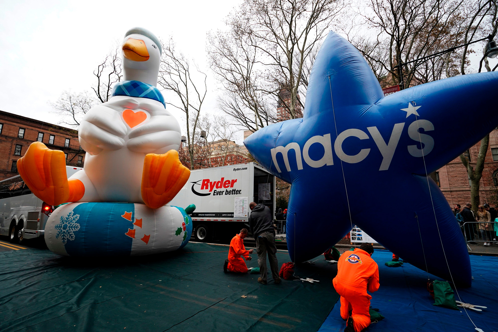 The Aflac Duck and Macys balloon are pictured during the Macy's Thanksgiving Day Parade balloon inflation in New York City on November 27, 2019.