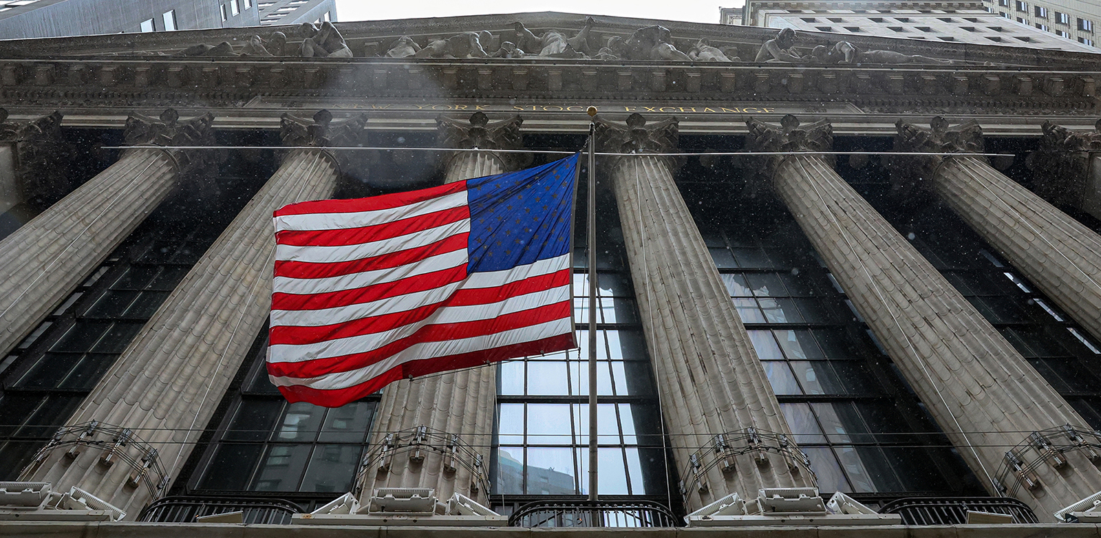 The U.S. flag flutters outside the New York Stock Exchange on March 13.