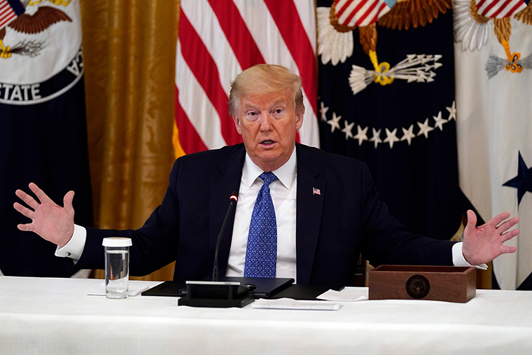 US President Donald Trump speaks during a Cabinet Meeting in the East Room of the White House, on Tuesday, in Washington.