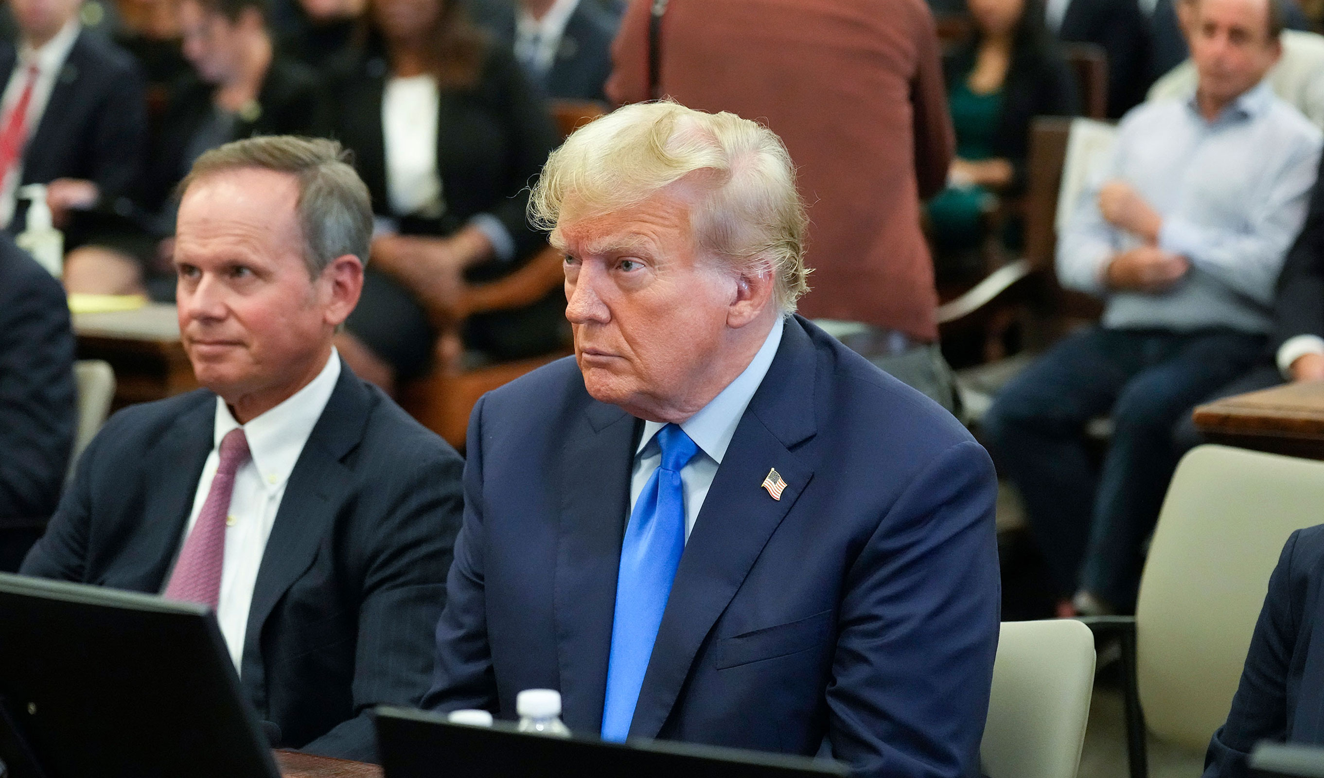 Former President Donald Trump, right, sits in the courtroom at New York Supreme Court, Monday, Oct. 2, 2023, in New York.