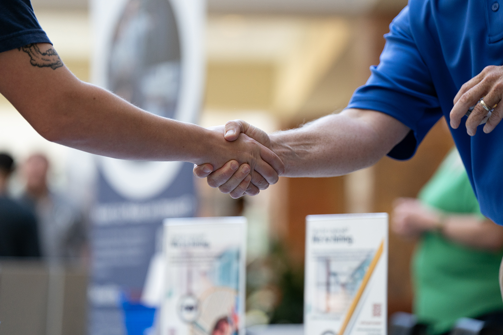 A jobseeker and recruiter shake hands at the Cape Fear Community College's Business and IT Career Fair at Cape Fear Community College North Building in Castle Hayne, North Carolina, on Sept. 20.