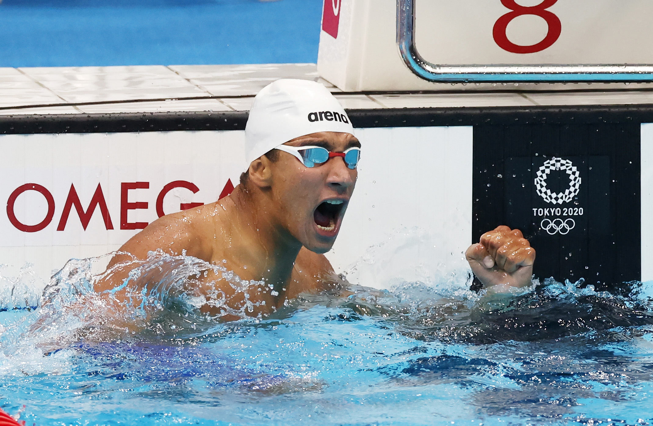 Ahmed Hafnaoui of Team Tunisia celebrates after winning the gold medal in the 400m freestyle final on July 25.