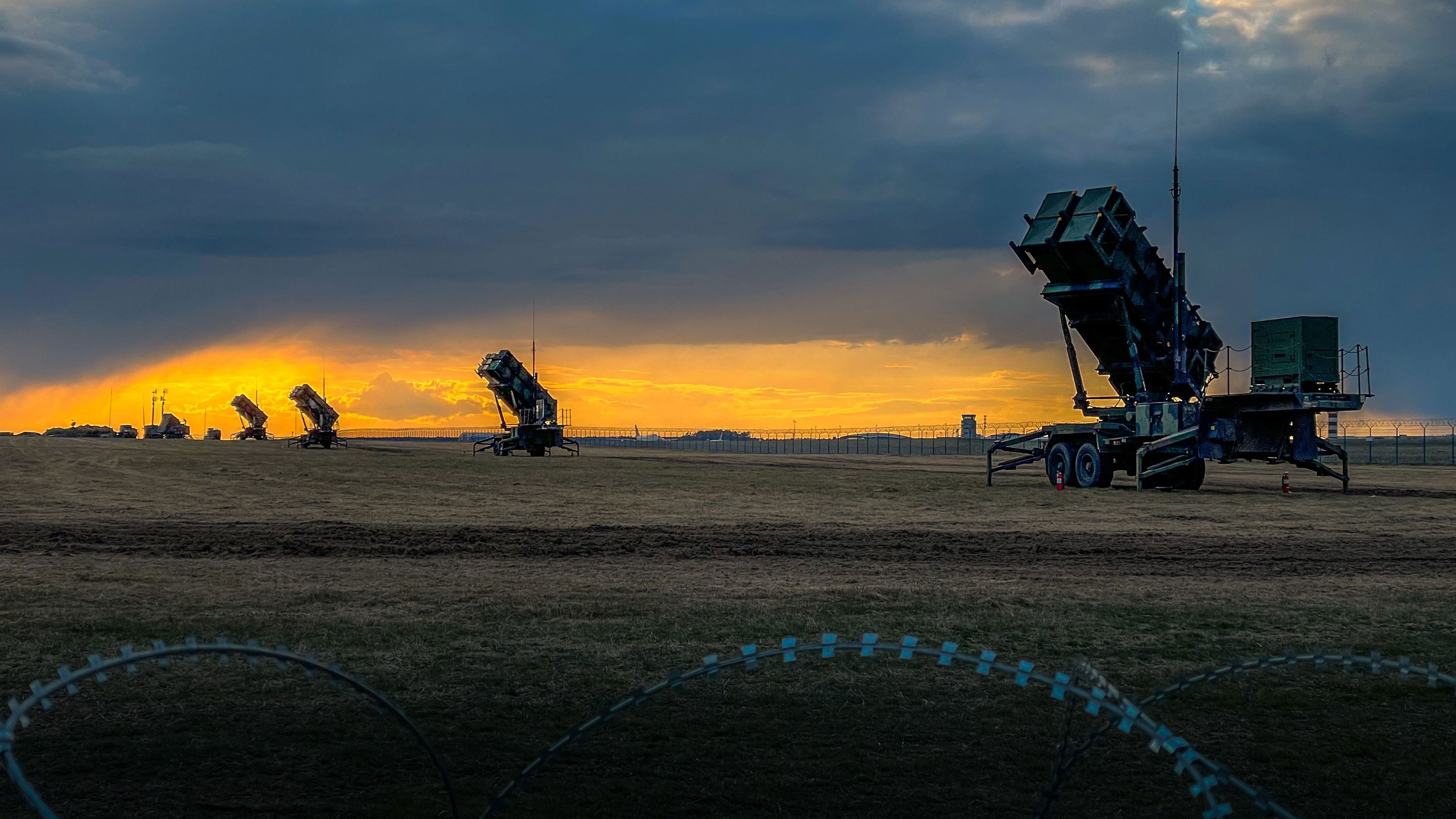 Patriot missile batteries from the 5th Battalion, 7th Air Defense Artillery Regiment stand ready at sunset in Poland on April 10, 2022. 