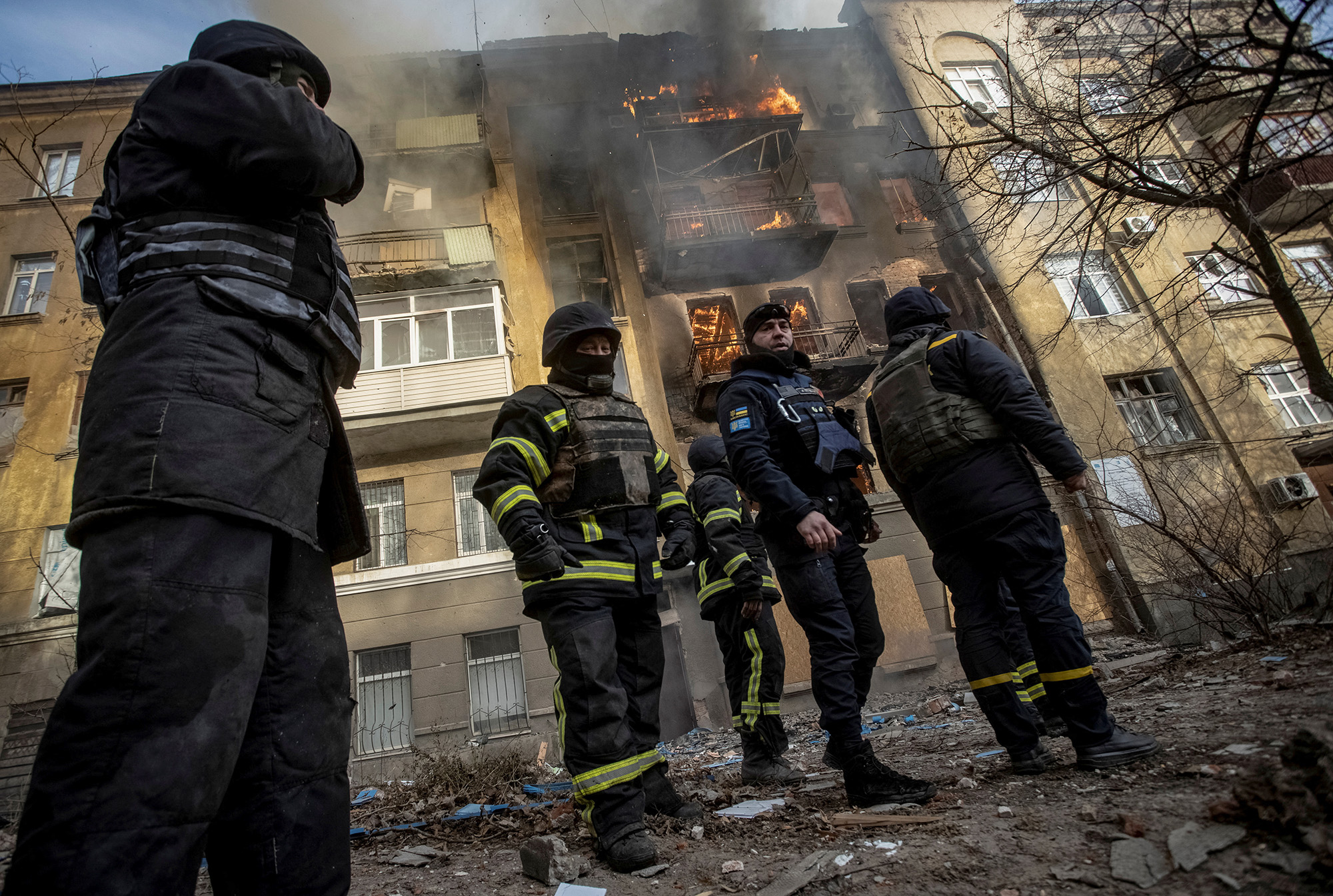 Firefighters work to put out a fire at a residential building hit by a Russian military strike in Bakhmut, Donetsk region, Ukraine, on December 7.