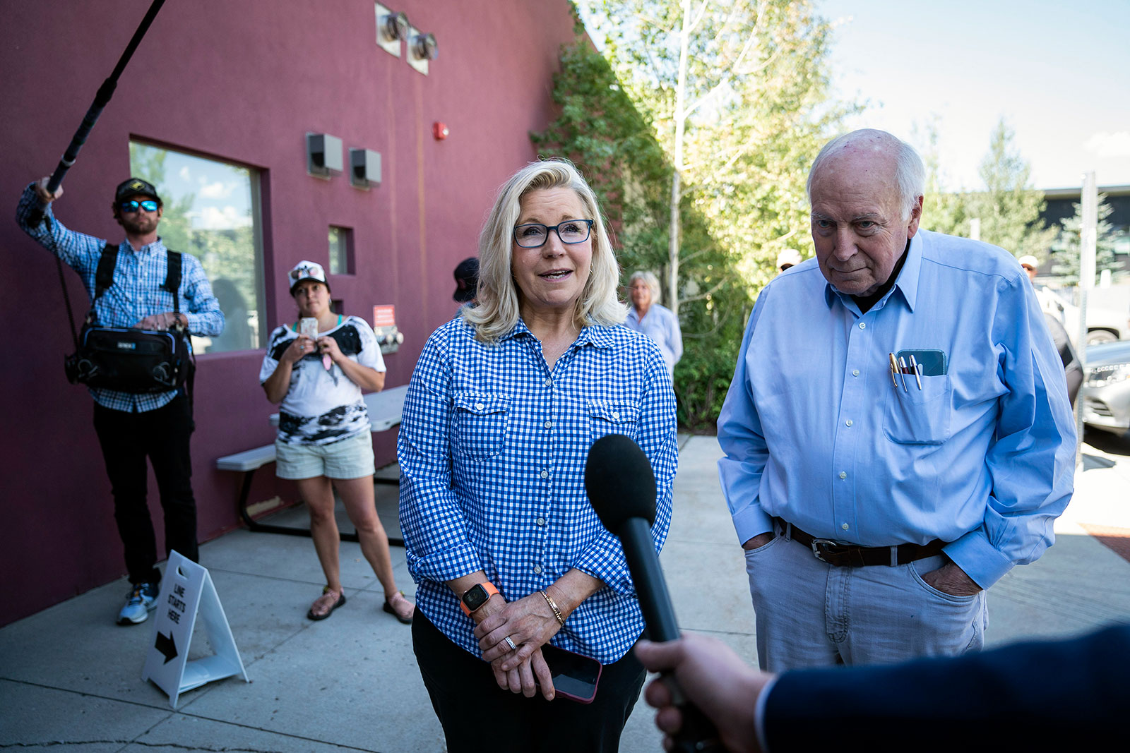 Rep. Liz Cheney arrives with her father, former Vice President Dick Cheney, to vote at the Teton County Library on Tuesday, August 16. 