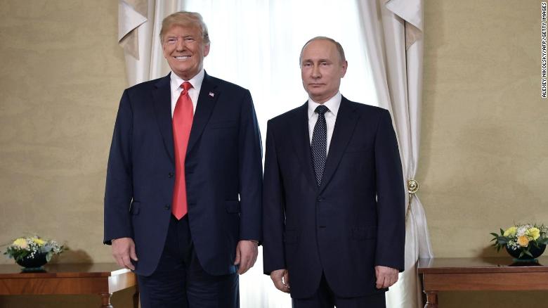 US President Donald Trump (left) and Russian President Vladimir Putin pose ahead a meeting in Helsinki, July 2018.