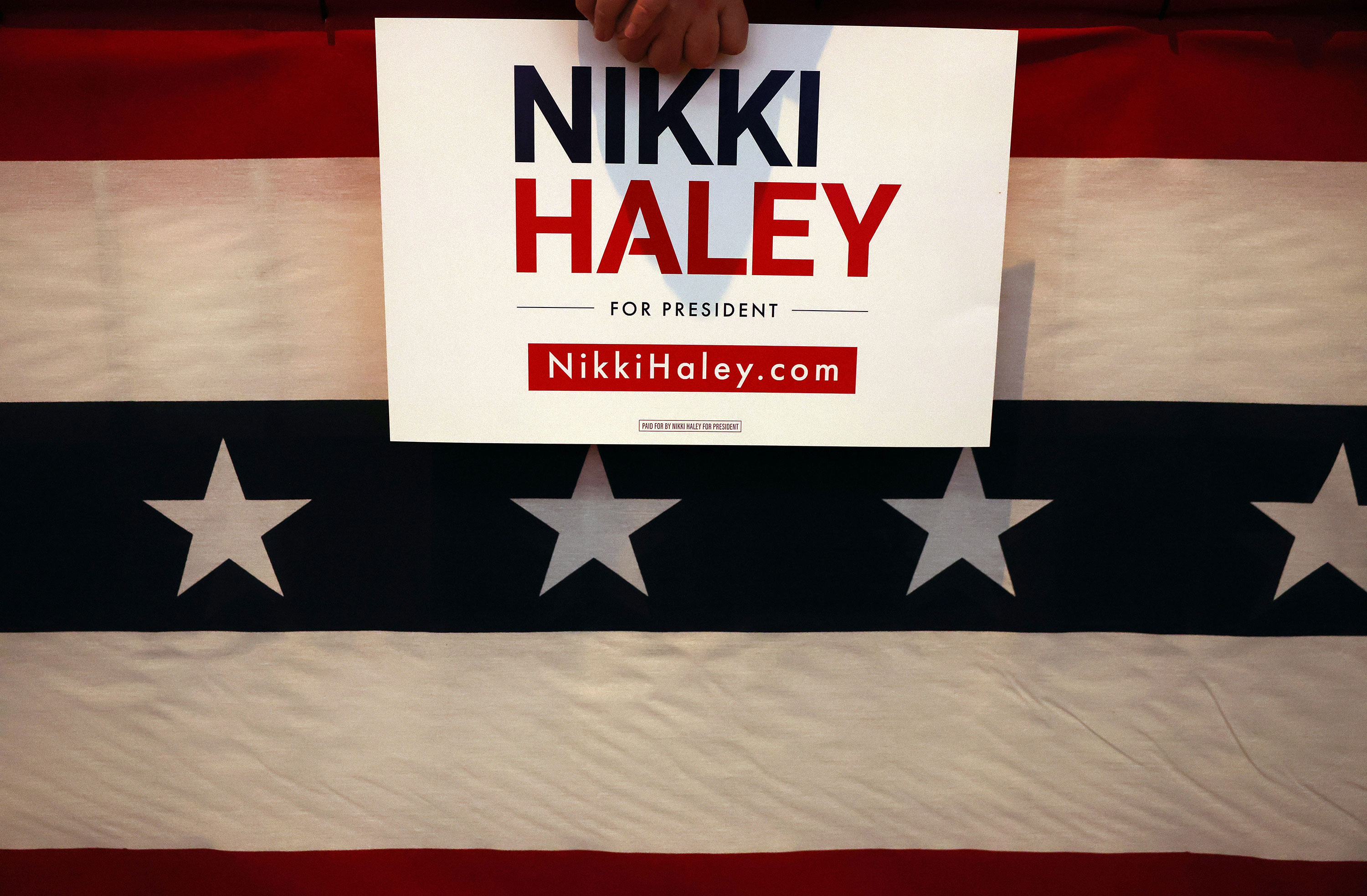 An attendee holds a Nikki Haley sign at a campaign event in Troy, Michigan, on Sunday.