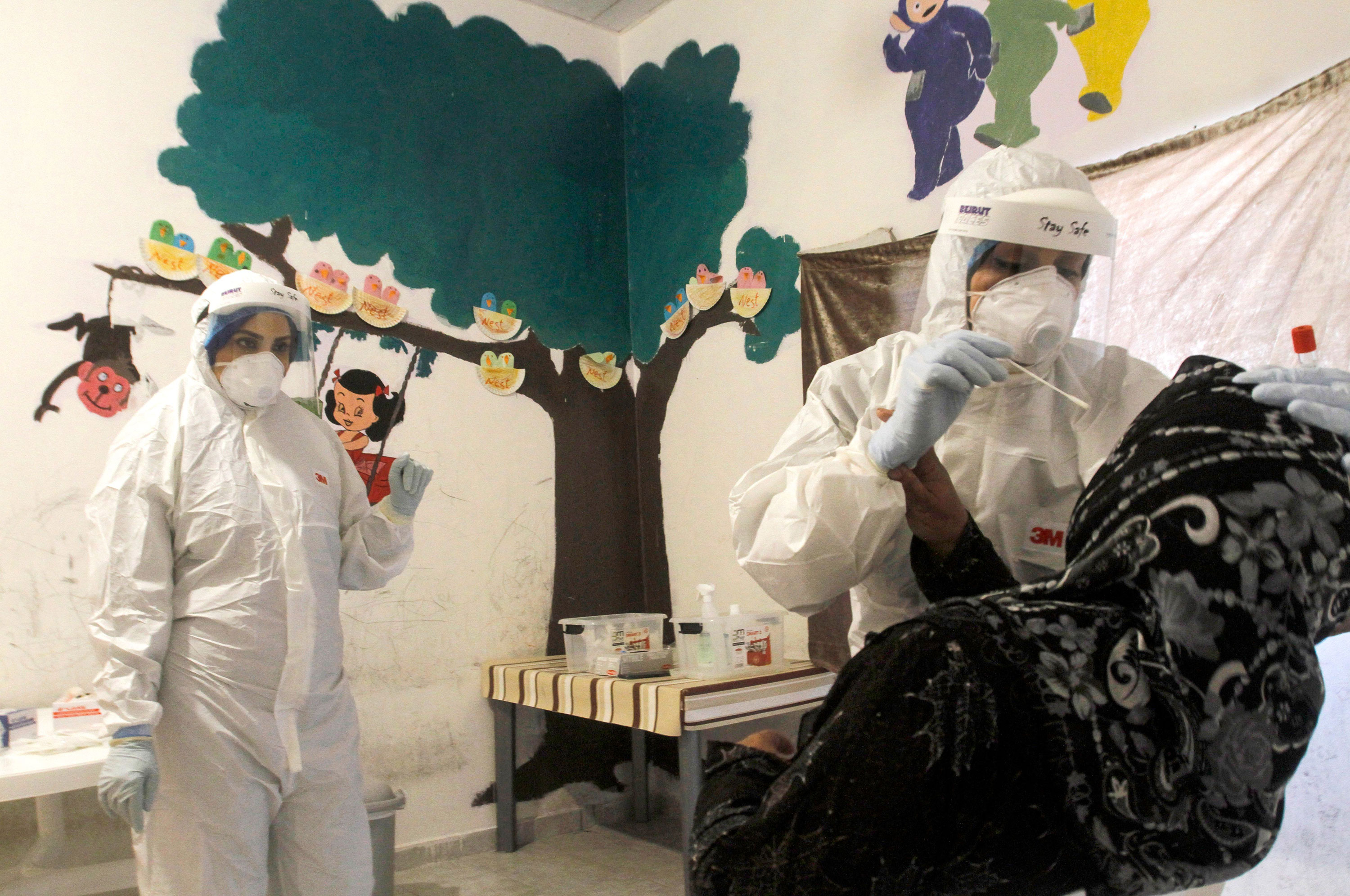 Workers administer a coronavirus test on May 28 in Sidon, Lebanon.