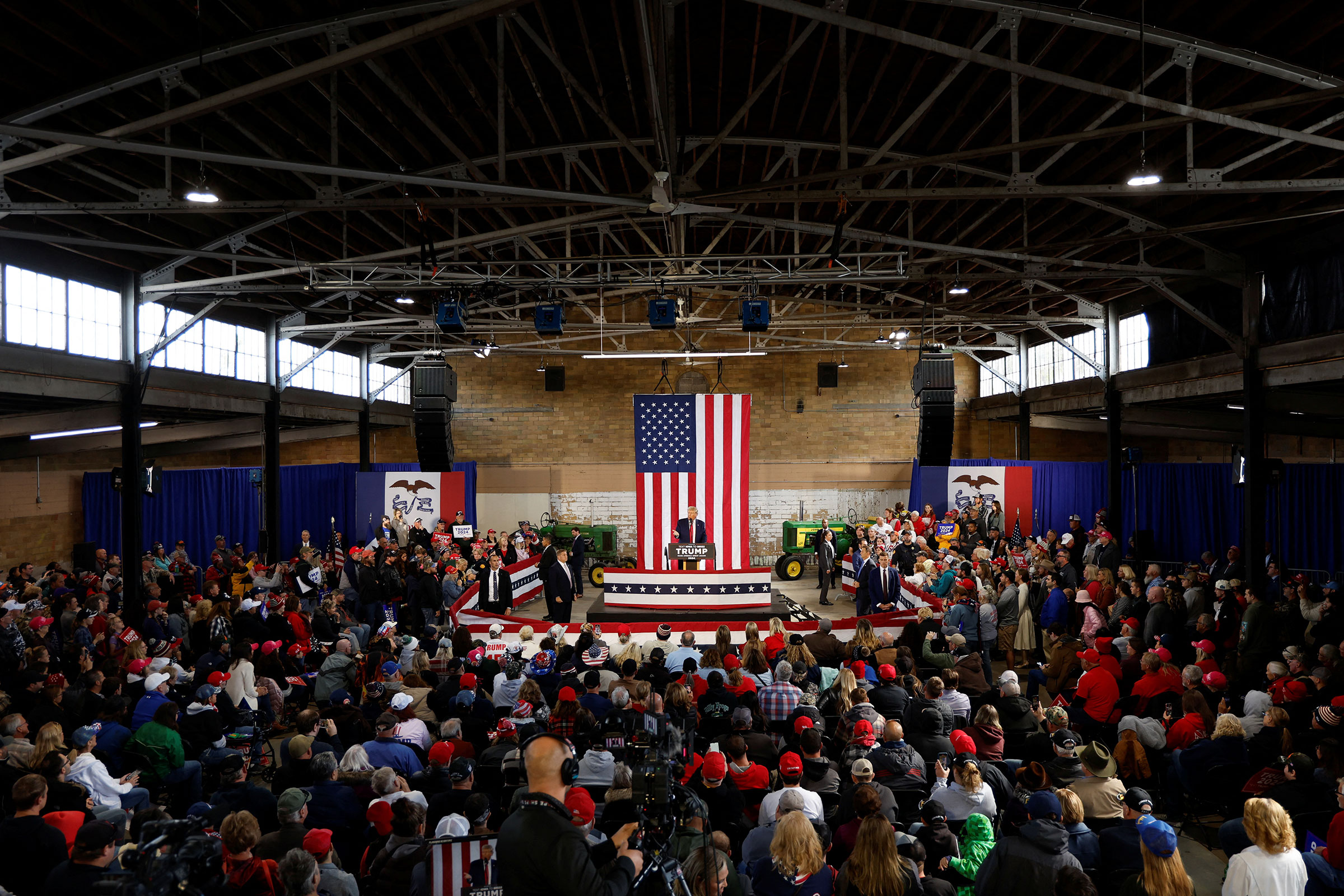 Donald Trump rallies with supporters at a "commit to caucus" event at the National Cattle Congress event space in Waterloo, Iowa, on October 7.