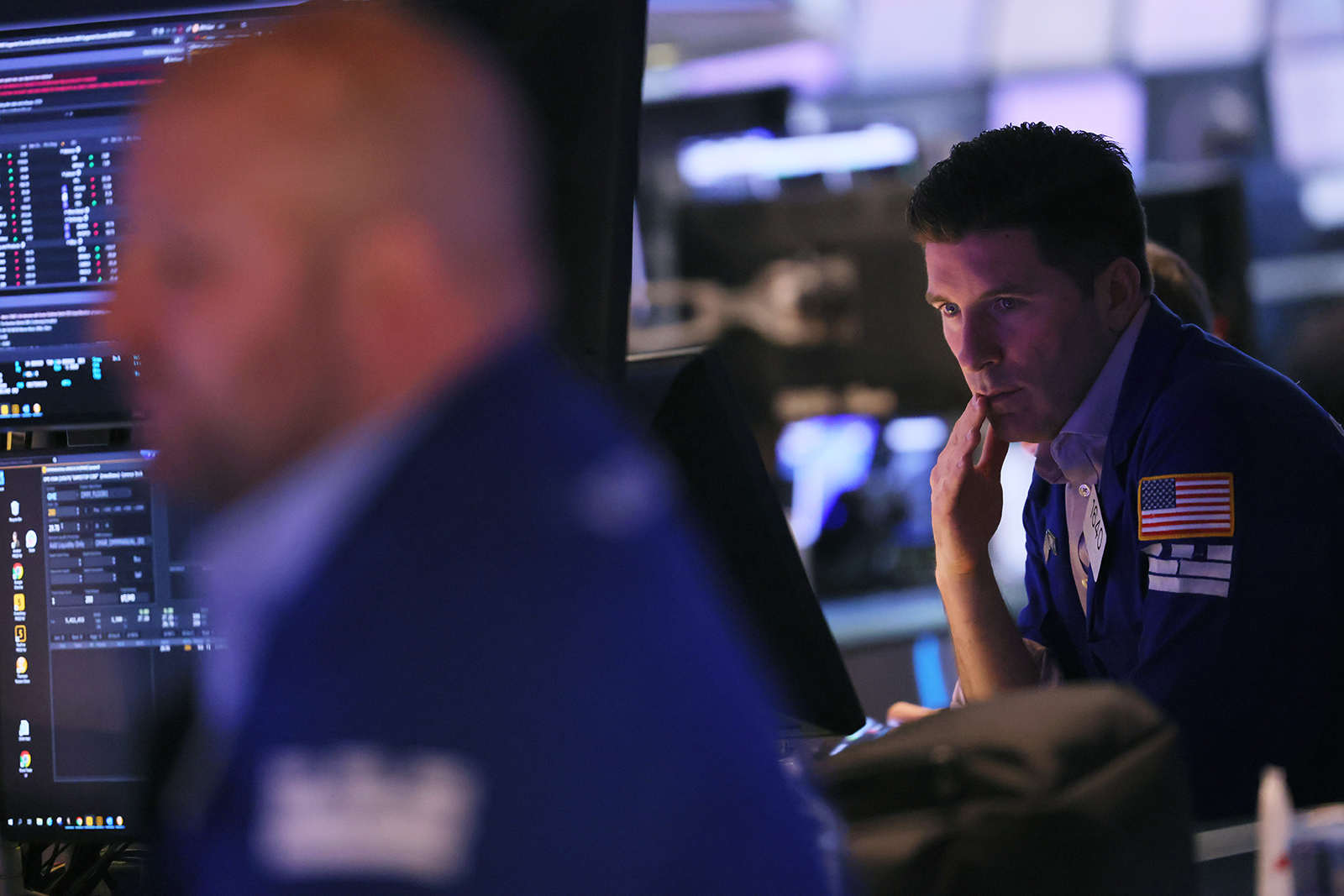 Traders work on the floor of the New York Stock Exchange on March 22.