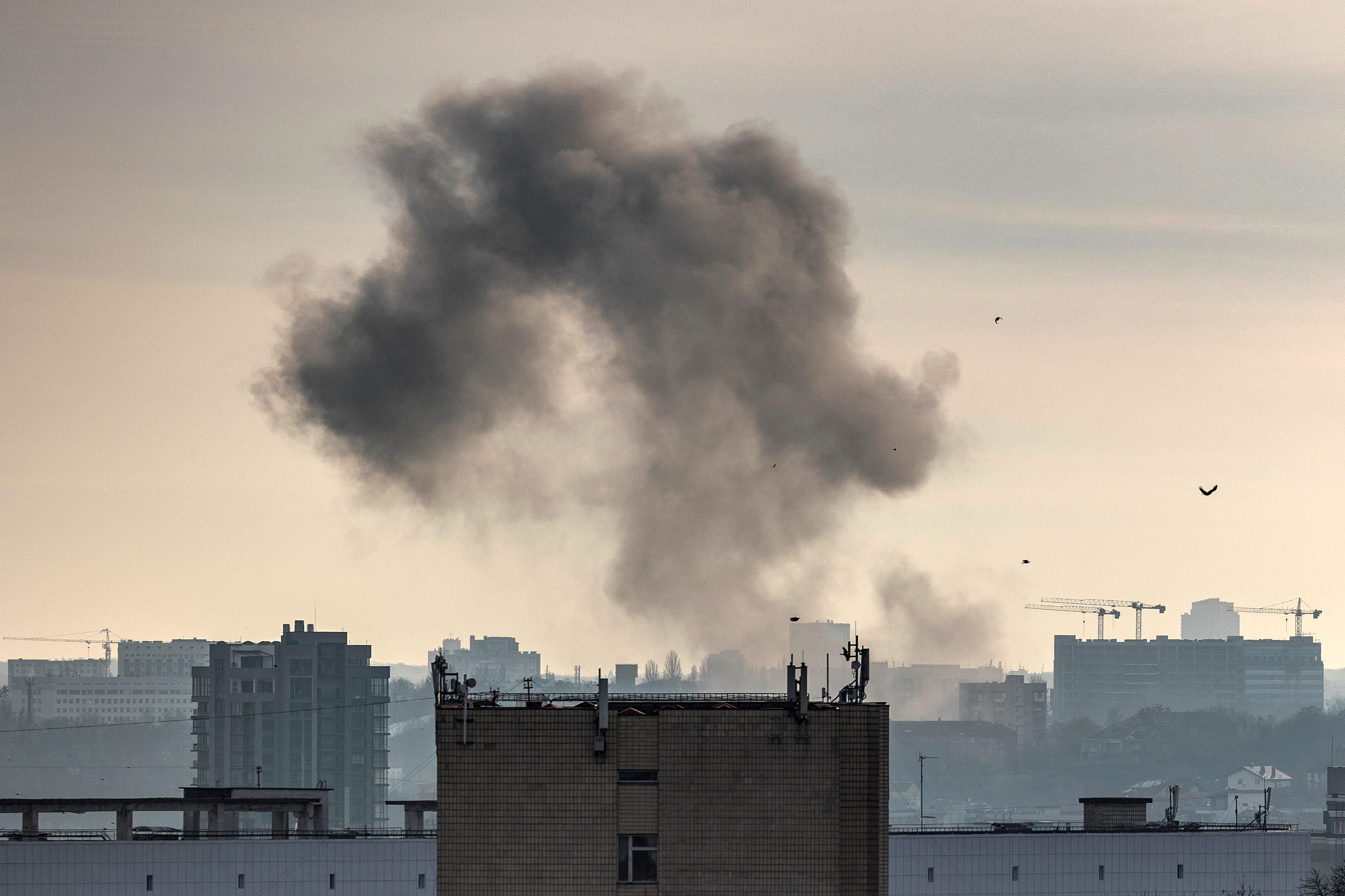 Smoke rises after a Russian missile strike in Kyiv, Ukraine, on December 31. 
