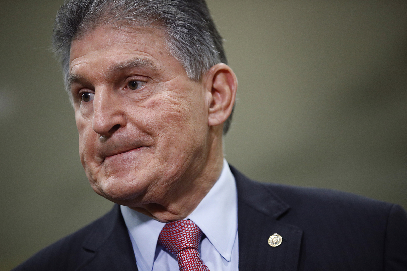 In this February 5 file photo, Sen. Joe Manchin speaks with reporters on Capitol Hill in Washington.