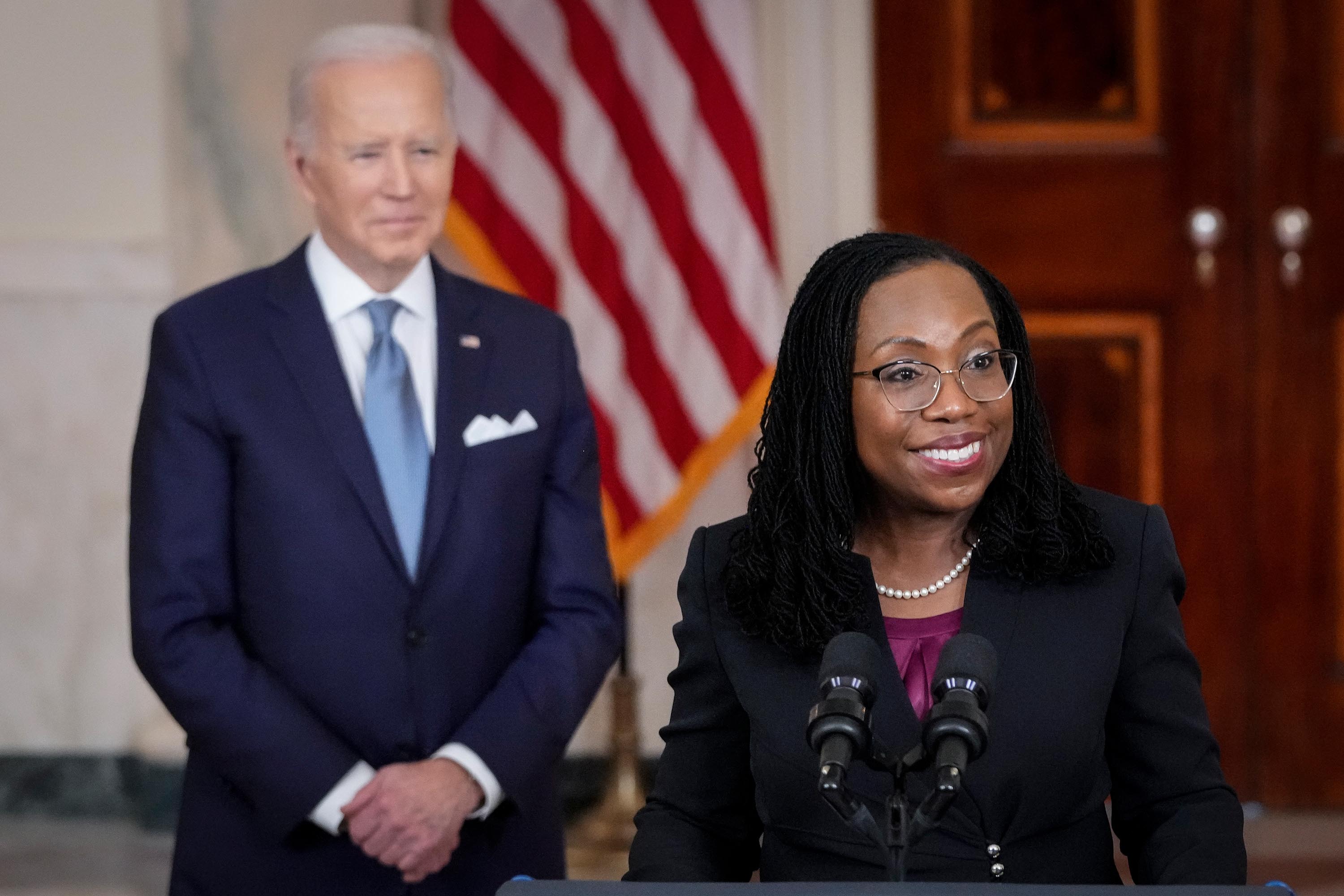 Biden looks on as Ketanji Brown Jackson delivers brief remarks as his nominee to the U.S. Supreme Court during an event in the Cross Hall of the White House February 25, 2022 in Washington, DC. 
