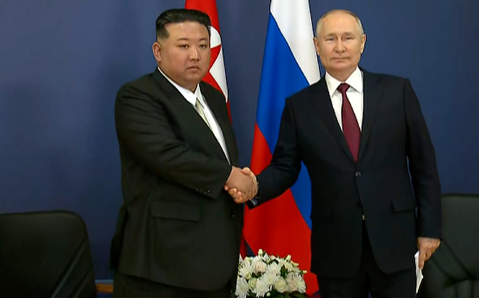 Kim Jong Un and Vladimir Putin shake hands as they begin their talks at the Vostochny Cosmodrome, Amur region, Russia, on September 13.