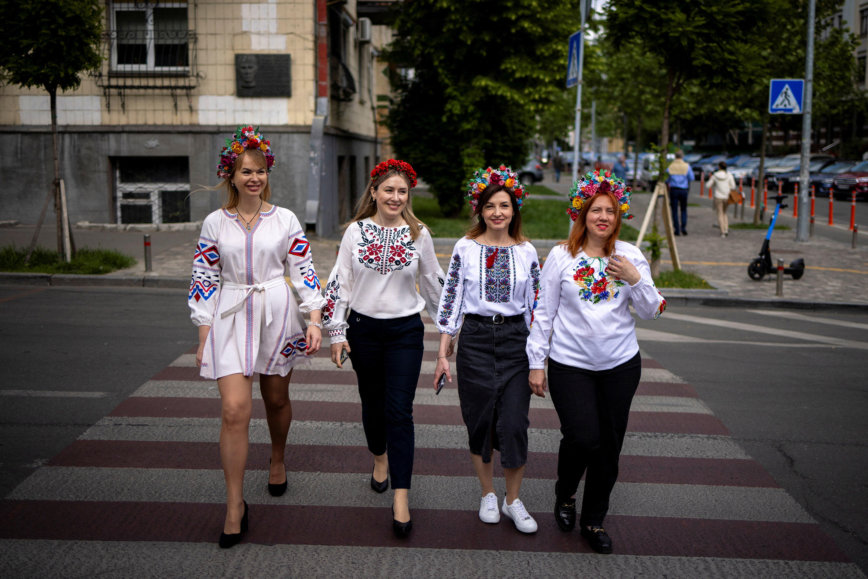 Women dressed in vyshyvankas cross a street in Kyiv, Ukraine, on Thursday.
