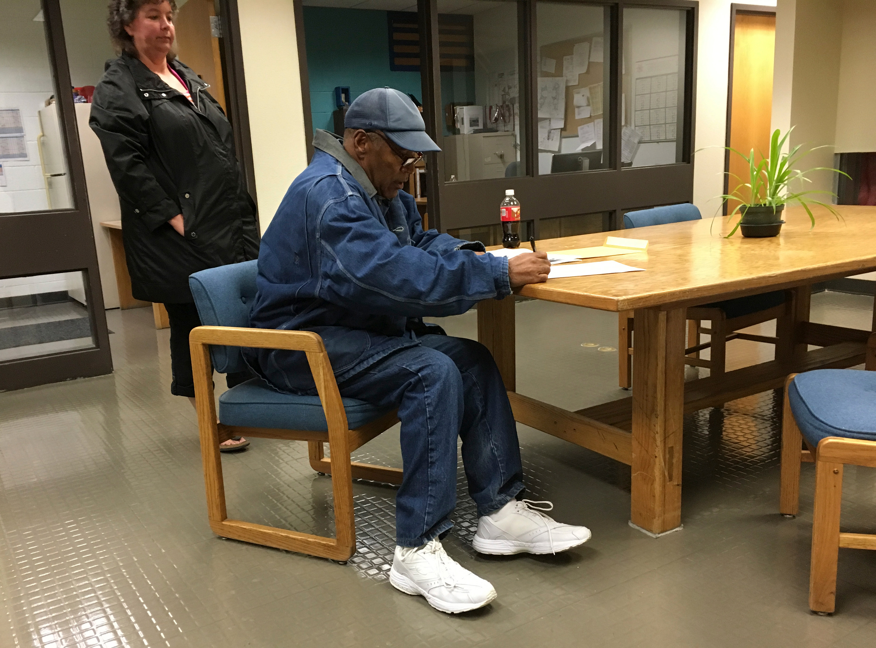 Simpson signs documents at the Lovelock Correctional Center in Nevada in September 2017, before being released. He had been serving time for his involvement in a 2007 armed robbery in Las Vegas.