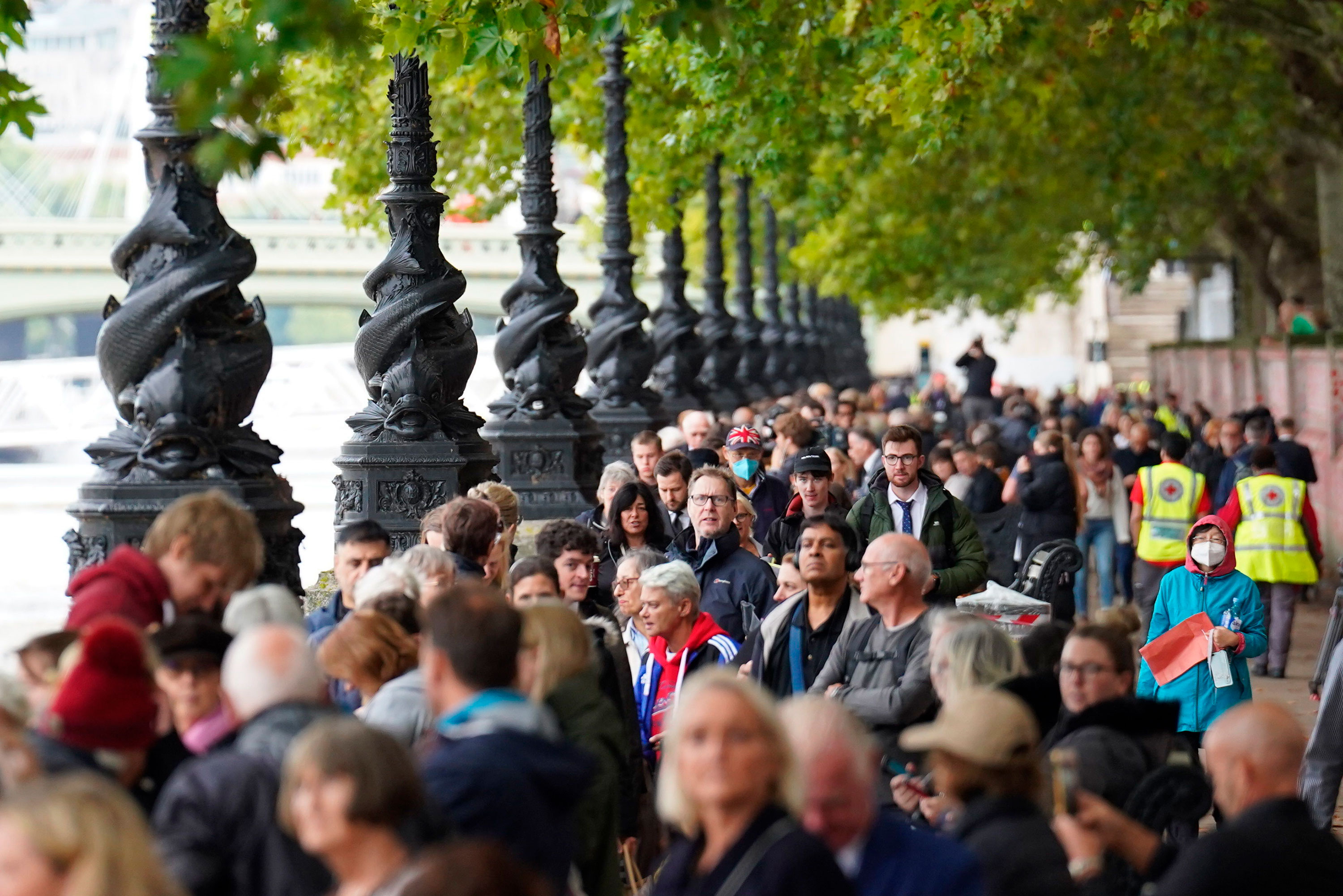 Members of the public queue on the South Bank as they wait to view Queen Elizabeth II lying in state.