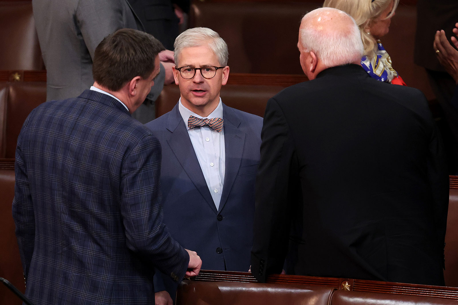 Rep. Patrick McHenry, center, talks to fellow House members on Thursday.