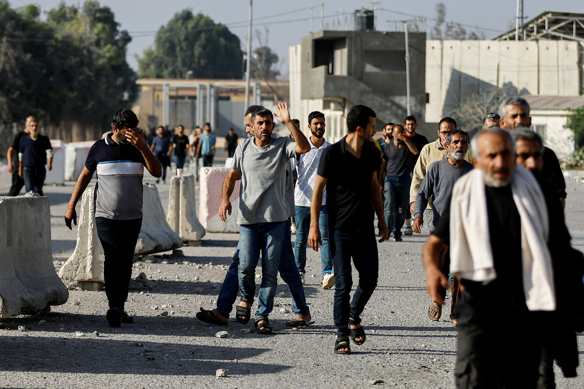 Palestinian labourers who were in Israel during the Hamas October 7 attack arrive into Gaza on November 3.