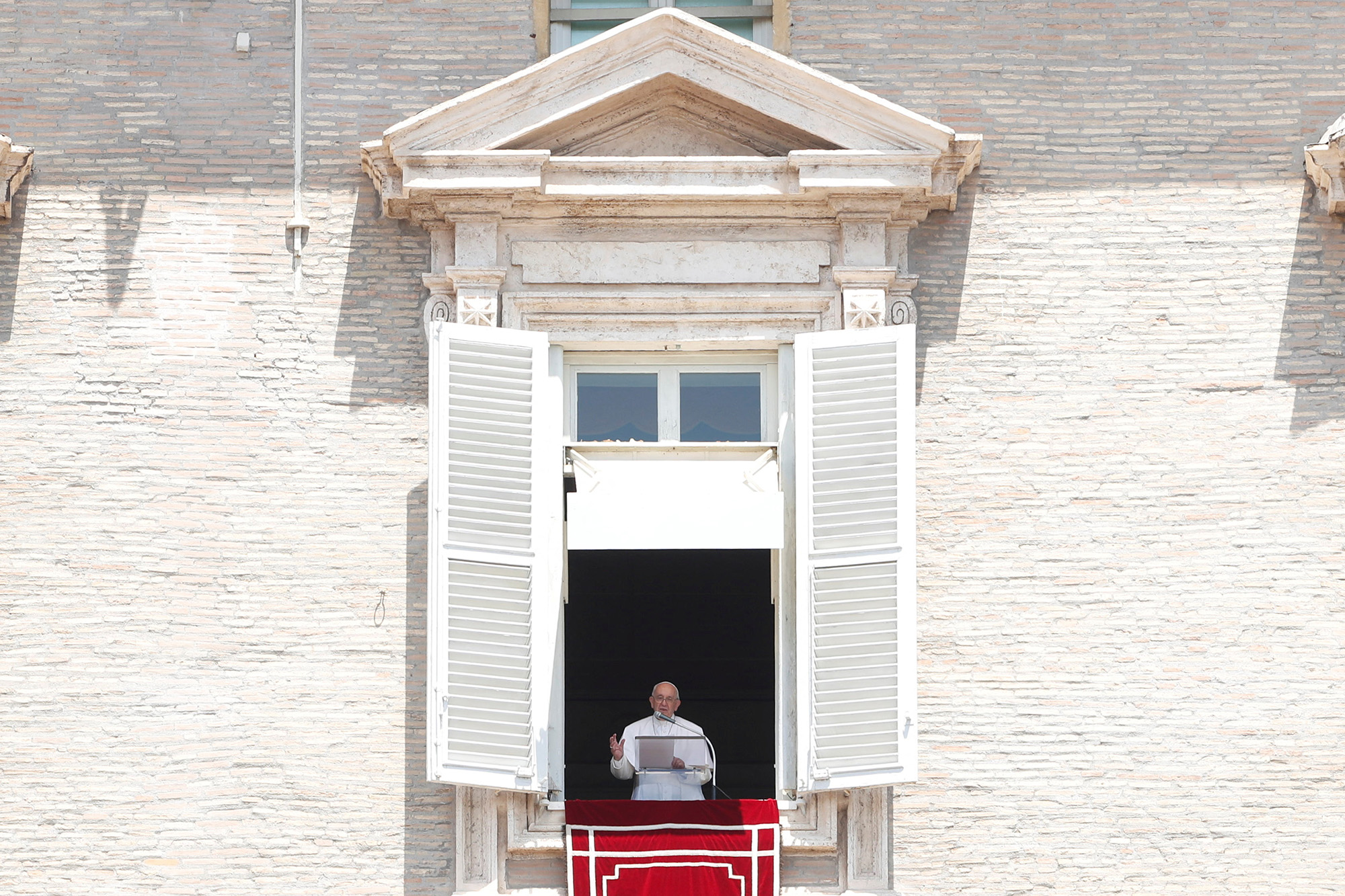 Pope Francis leads Angelus prayer from his window at the Vatican, Italy, on June 29.