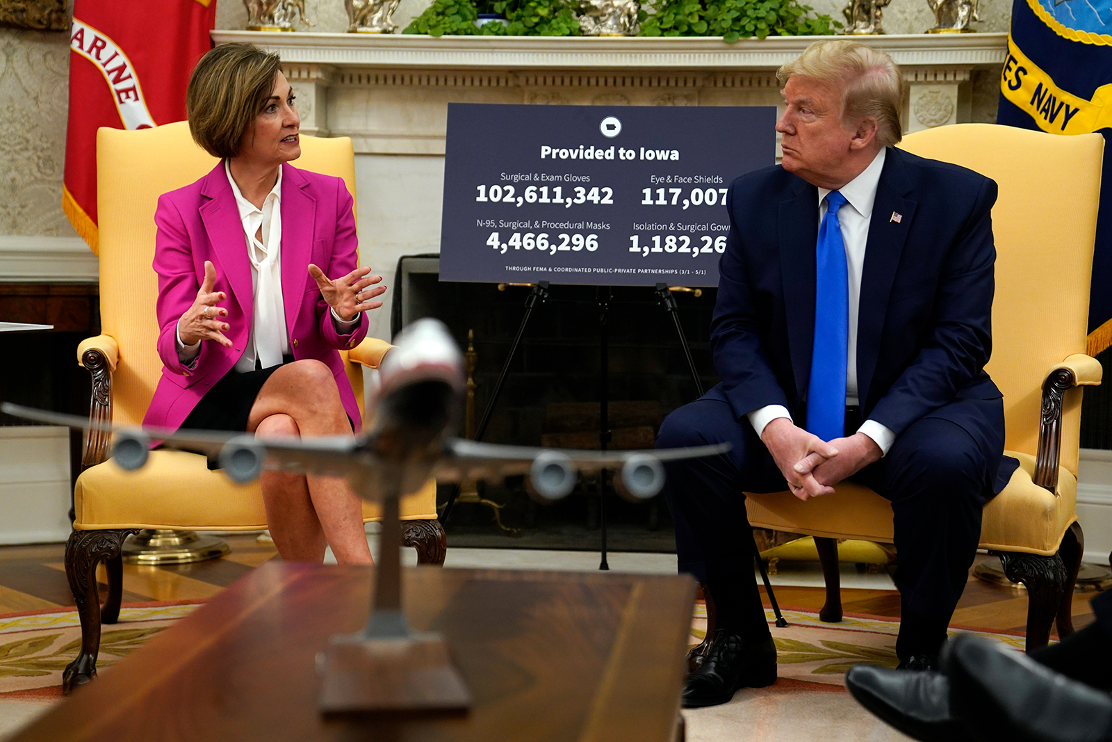 President Donald Trump listens to Iowa Gov. Kim Reynolds during a meeting in the Oval Office on, Wednesday, May 6.