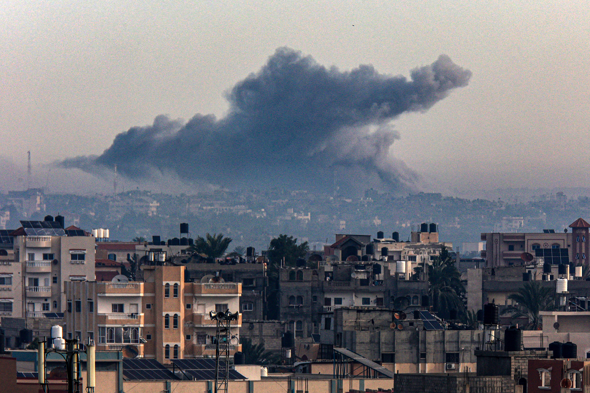 Smoke rises over Khan Younis in southern Gaza during Israeli bombardment on December 20.