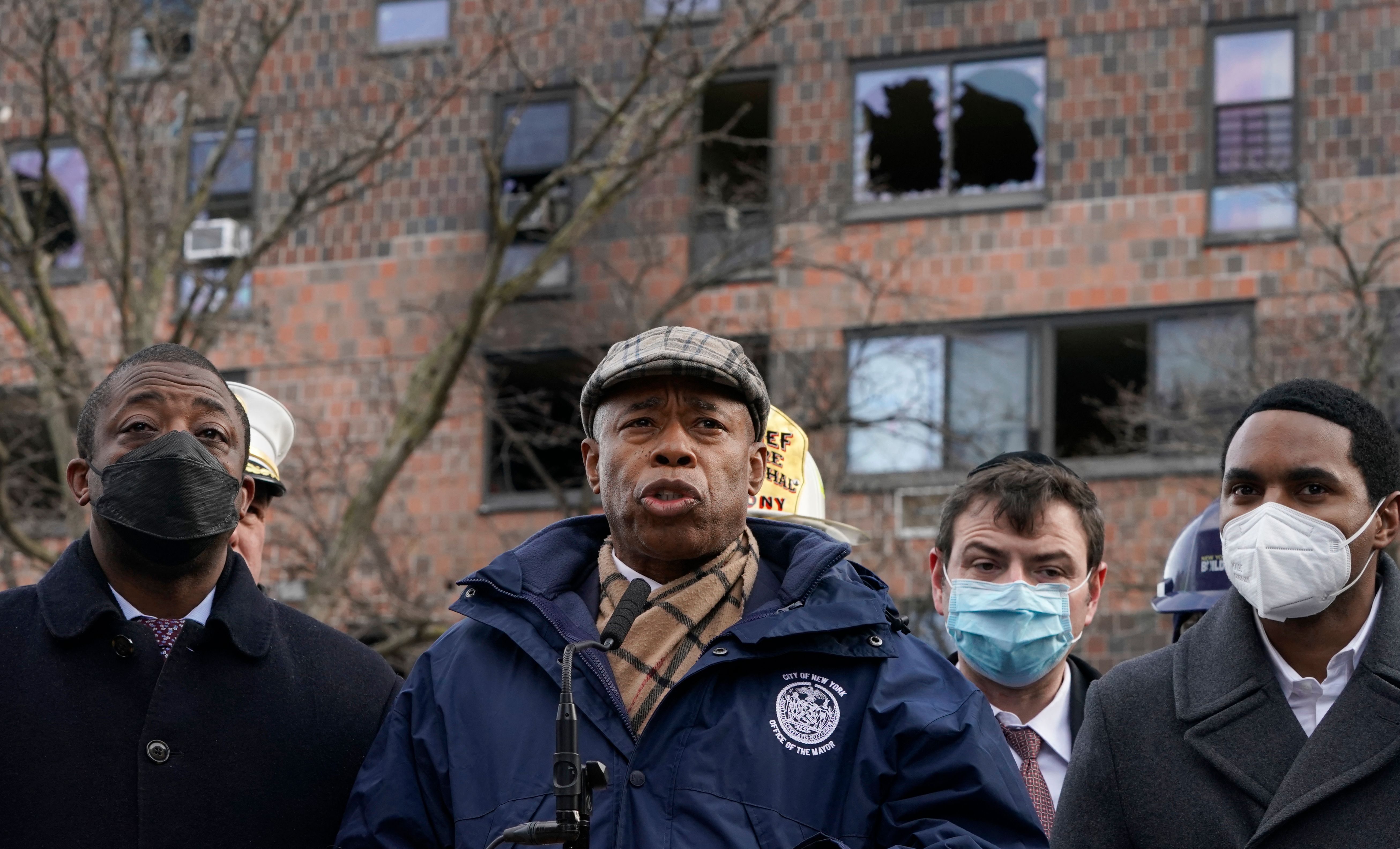 New York City Mayor Eric Adams during a news conference on Monday outside the apartment building in the Bronx, where a deadly fire occurred.  