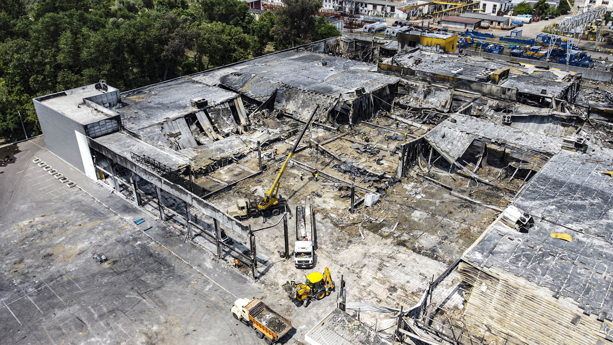 An aerial view of debris removal works at a destroyed shopping mall targeted by a Russian missile strike in Kremenchuk, Ukraine, on June 29.