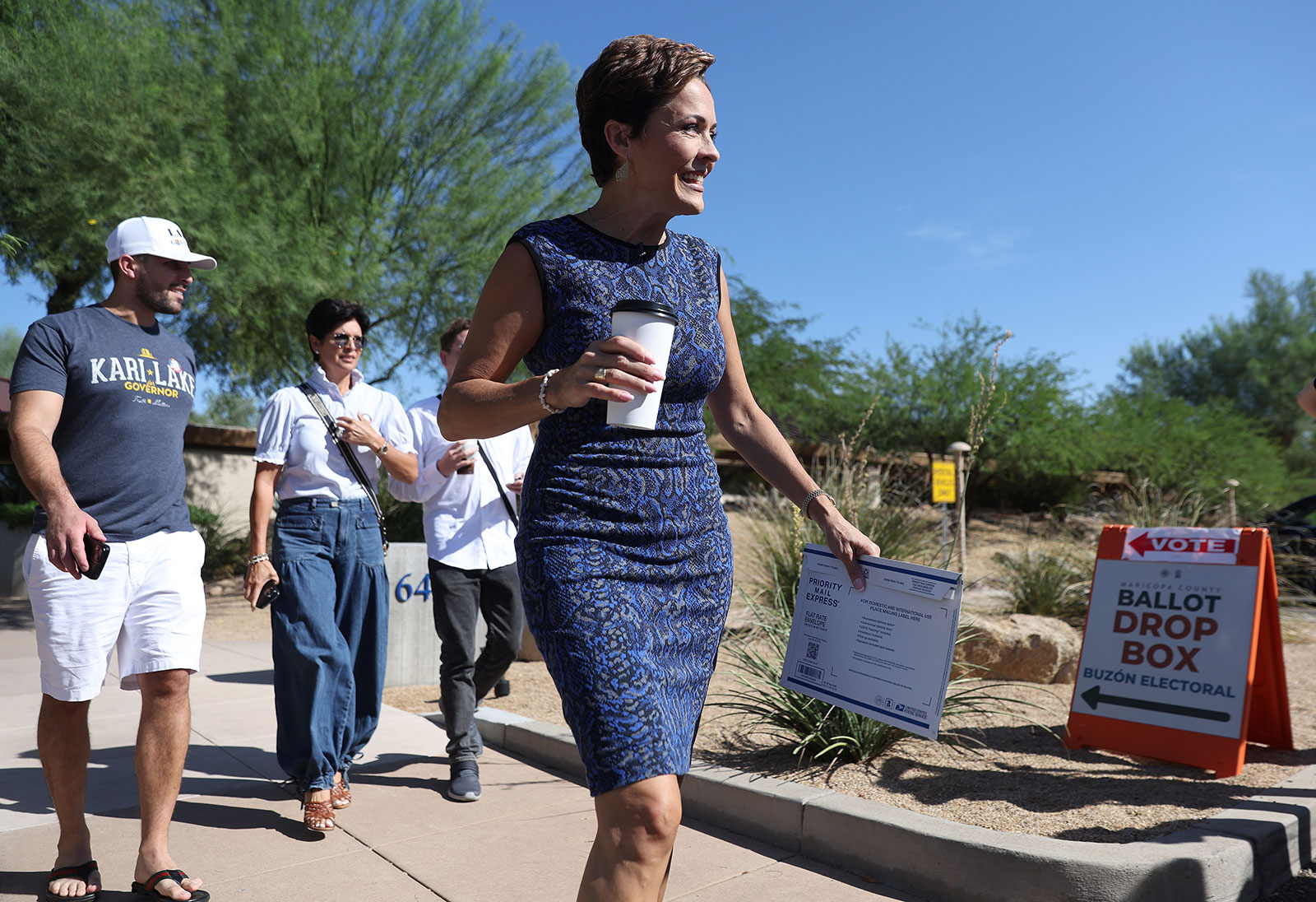 Republican candidate for Arizona governor Kari Lake leaves a polling place after voting in the Arizona primary on Tuesday in Paradise Valley, Arizona.