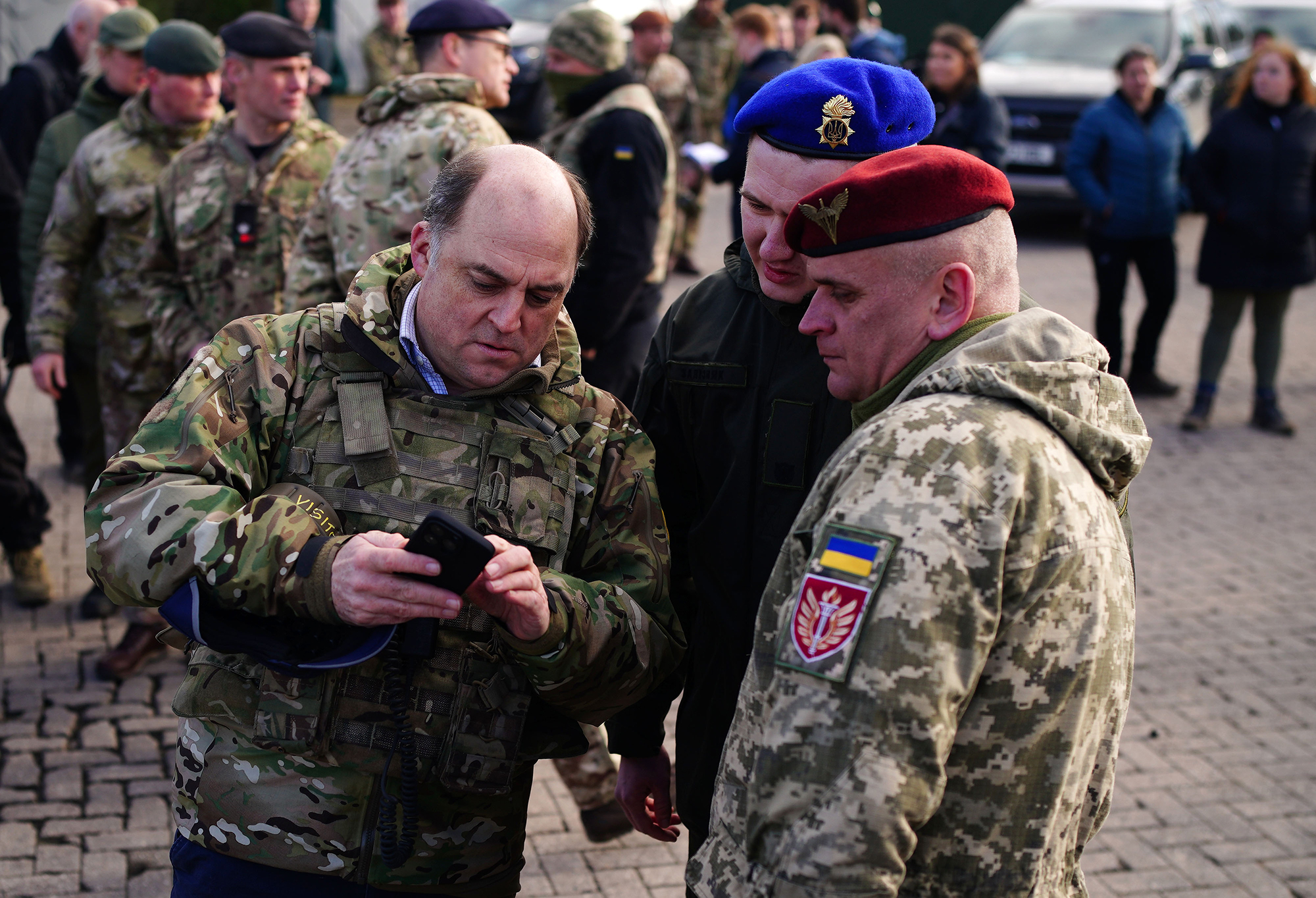 Defence Secretary Ben Wallace, left, meets Ukrainian soldiers during a visit to Bovington Camp on February 22, in Dorset, England.