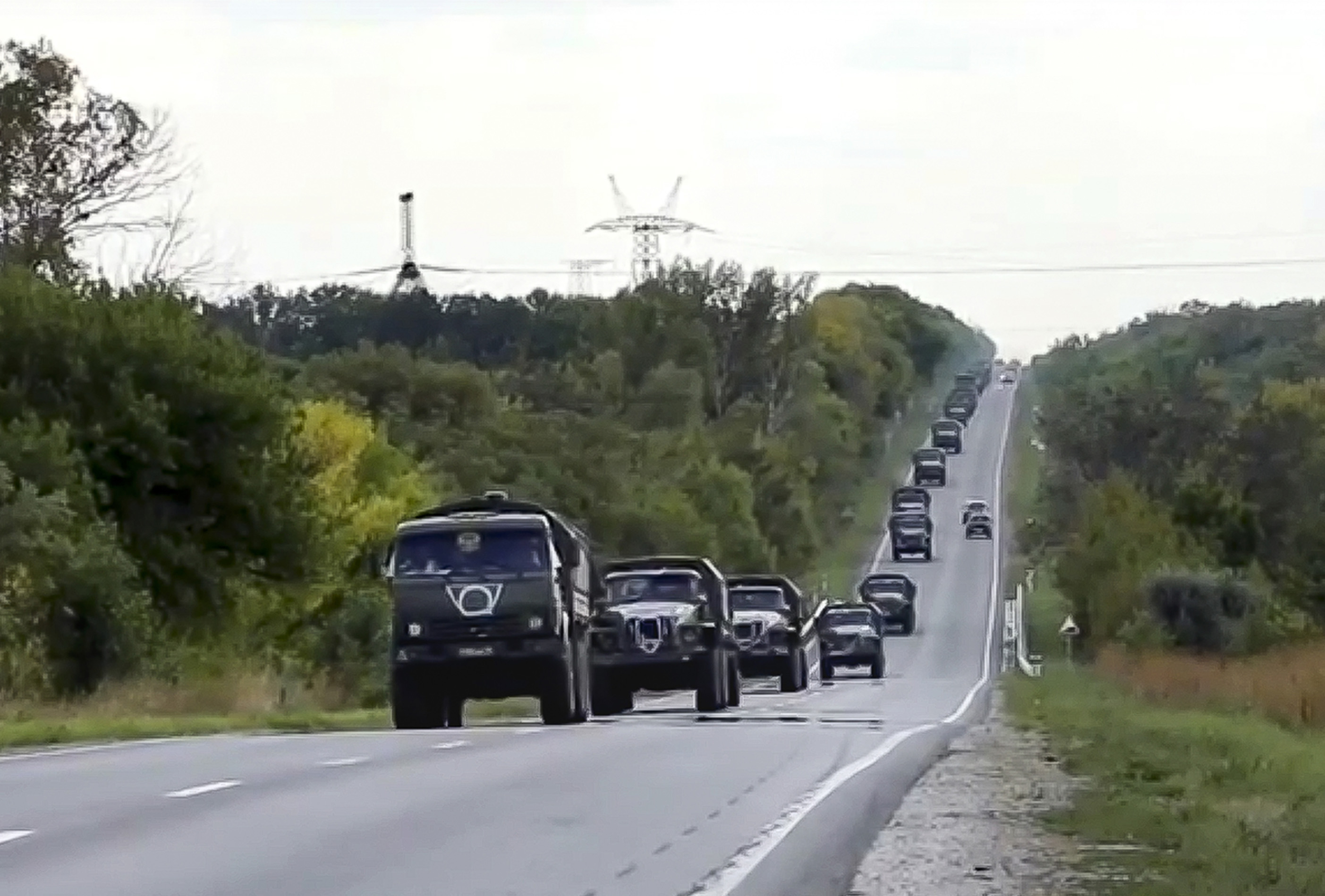 In this handout photo taken from video released by Russian Defense Ministry Press Service on Friday, September 9, Russian military vehicles drive to the Kharkiv direction on a mission in Ukraine. 