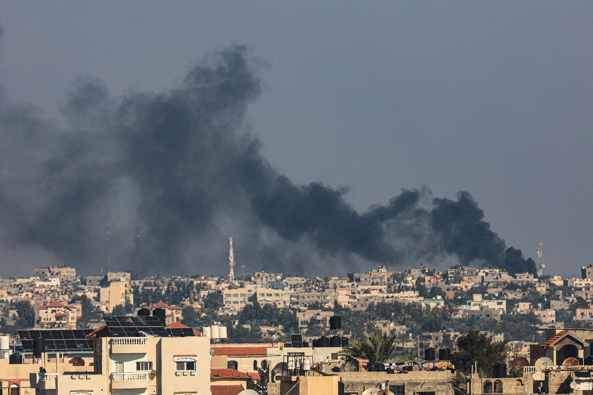 Smoke billows over Khan Younis, Gaza, following Israeli bombardment on December 15.
