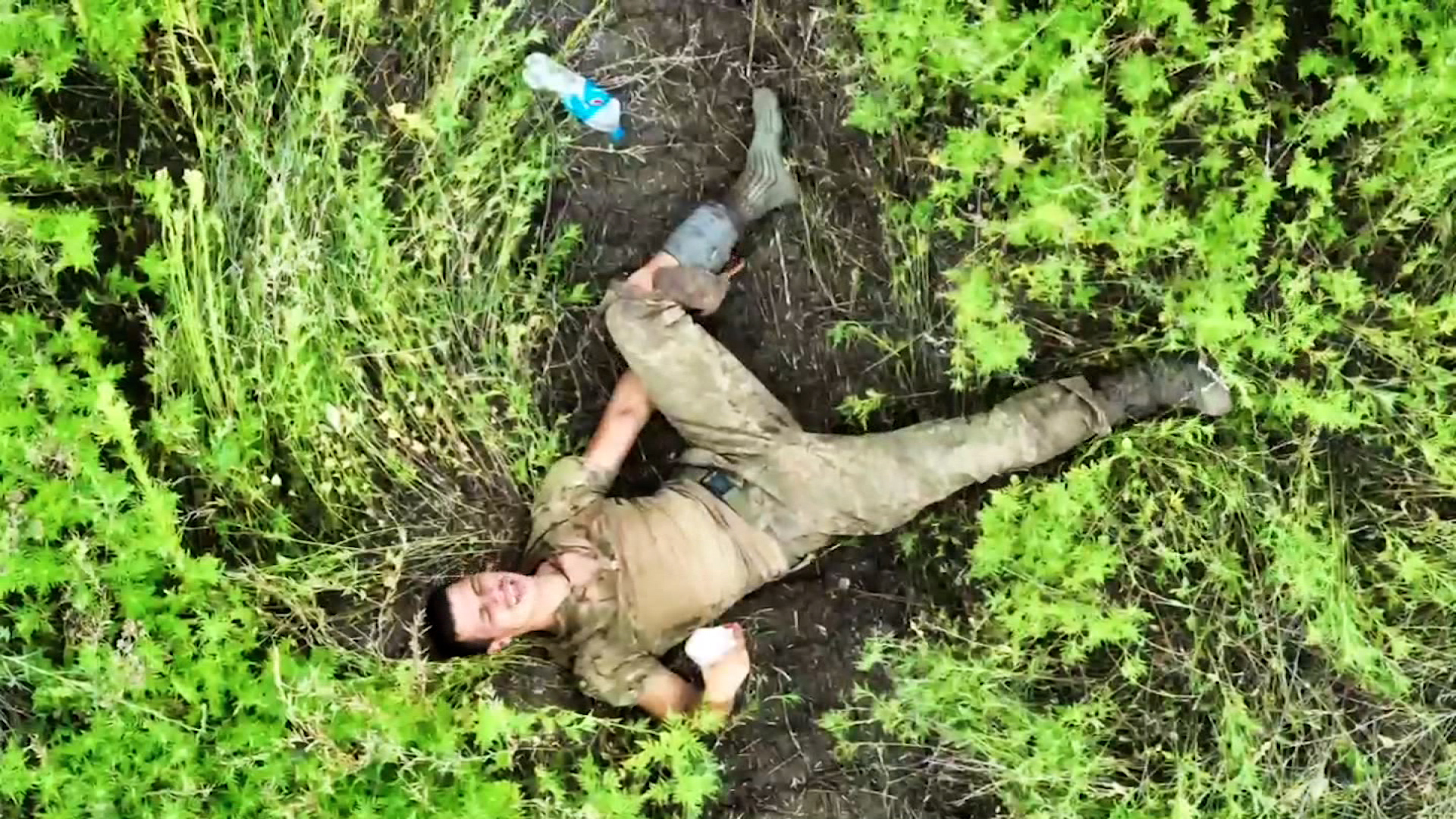 Drone footage shows wounded Ukrainian soldier, Serhiy, as he awaits rescue after being separated from his unit.