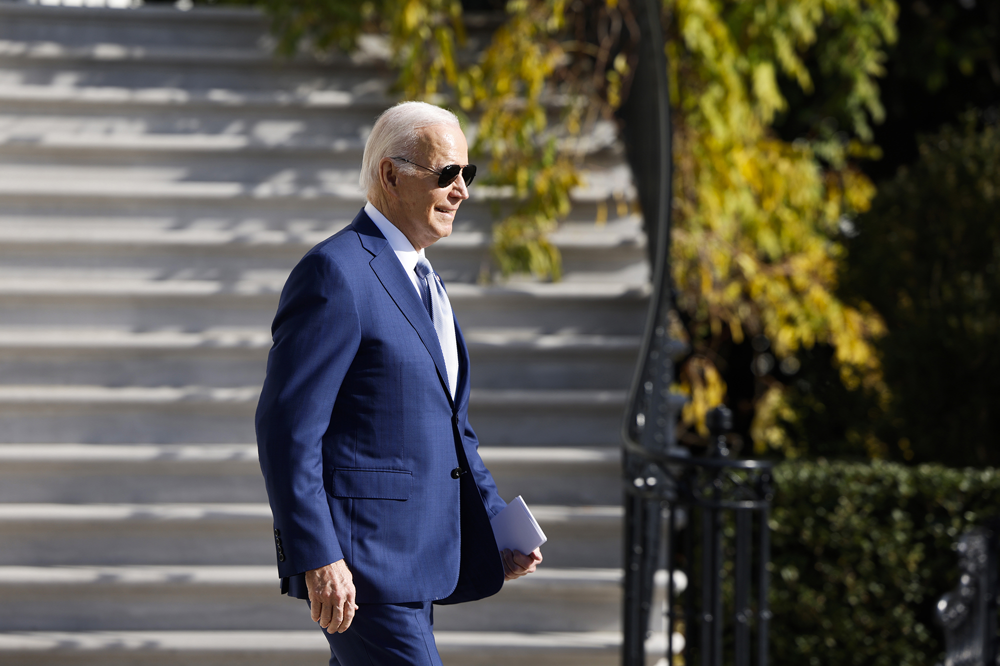 President Joe Biden walks on the South Lawn to board Marine One before departing the White House on December 8.