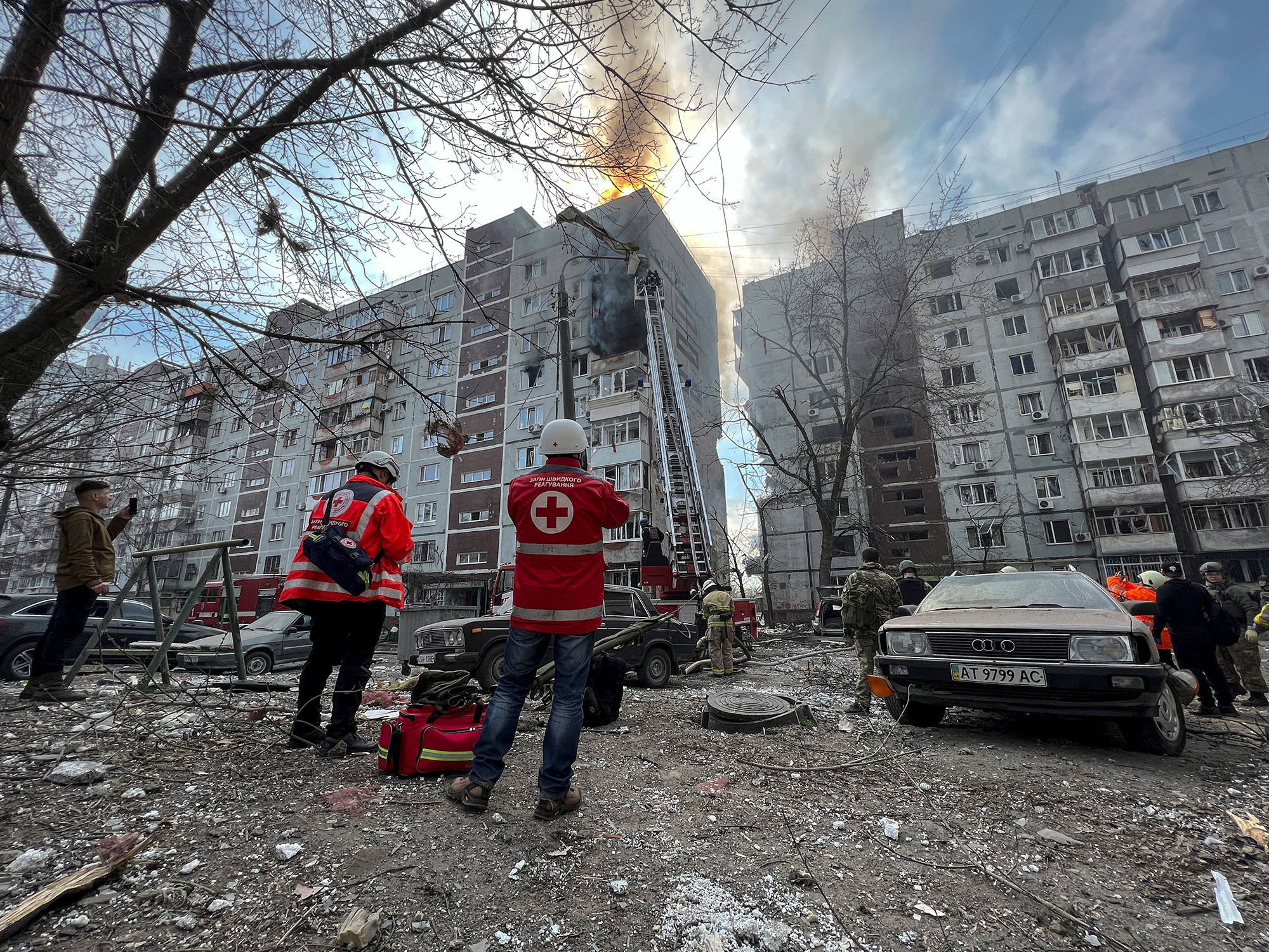 Paramedics and rescuers work at a site of a residential building damaged by a Russian missile strike in Zaporizhzhia, Ukraine, on March 22.