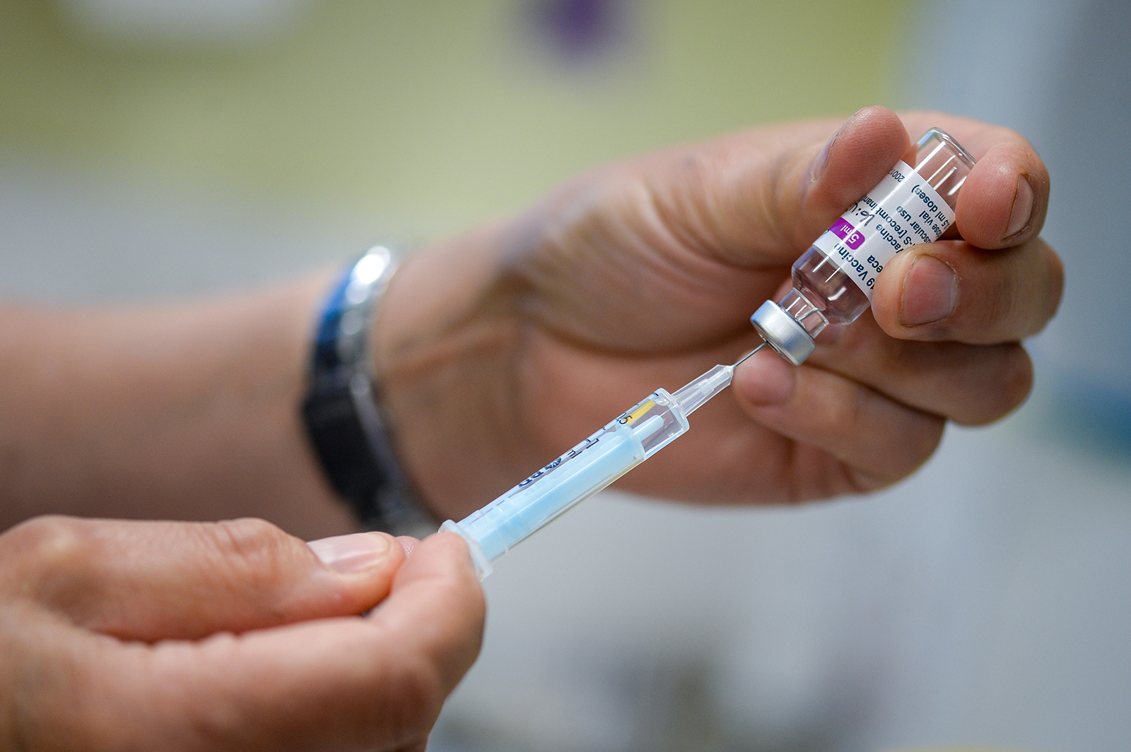 A vaccinator administers the Oxford-AstraZeneca Covid-19 Vaccine at a medical center in Bridport, England, on March 20.