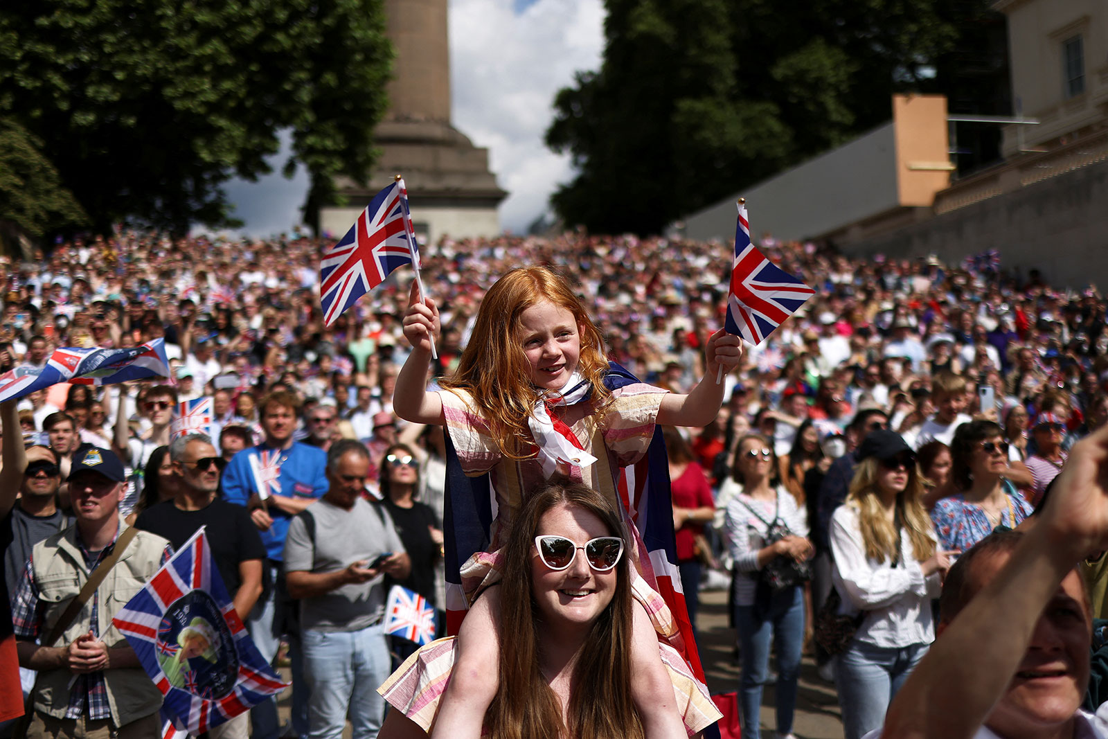 People attend celebrations of Britain's Queen Elizabeth's Platinum Jubilee along The Mall.
