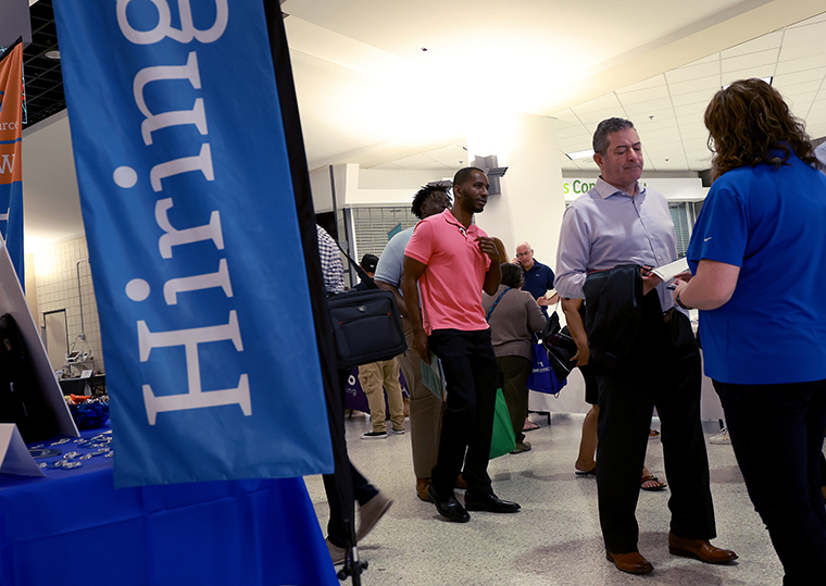 People attend the Mega Job Fair held at the FLA Live Arena on June 23 in Sunrise, Florida. 