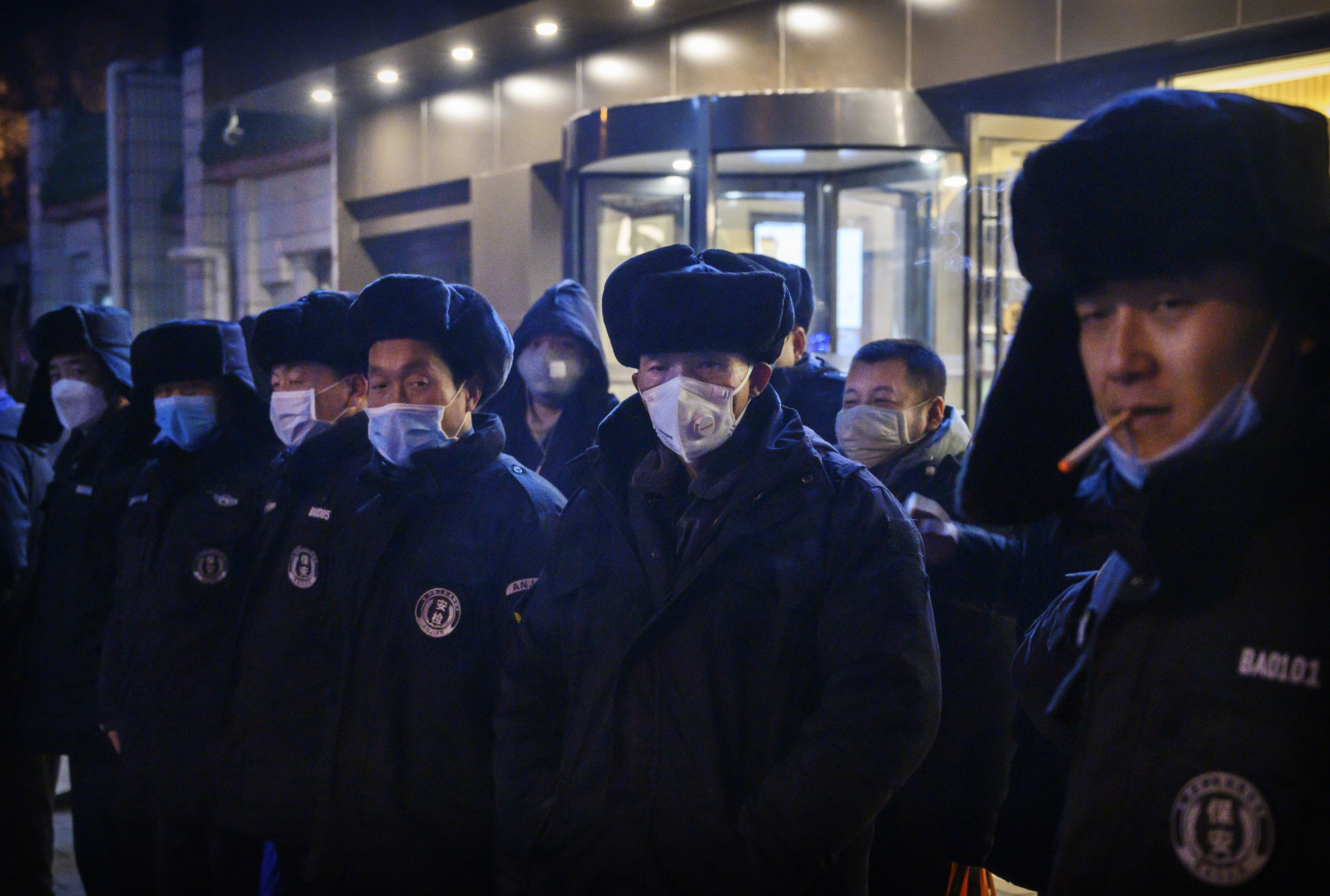 Chinese security guards line up before duty on February 9, 2020 in Beijing, China.