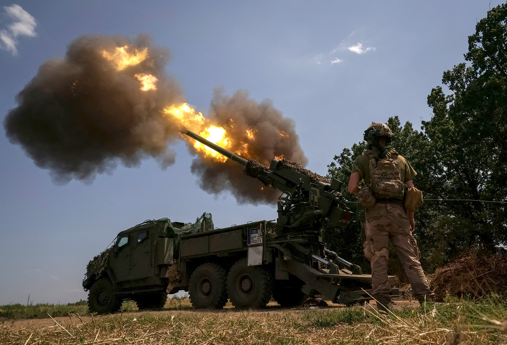 A Ukrainian serviceman of the 57th Kost Hordiienko Separate Motorised Infantry Brigade fires a 2S22 Bohdana self-propelled howitzer towards Russian troops at a position near the city of Bakhmut in Donetsk region, Ukraine on July 5.