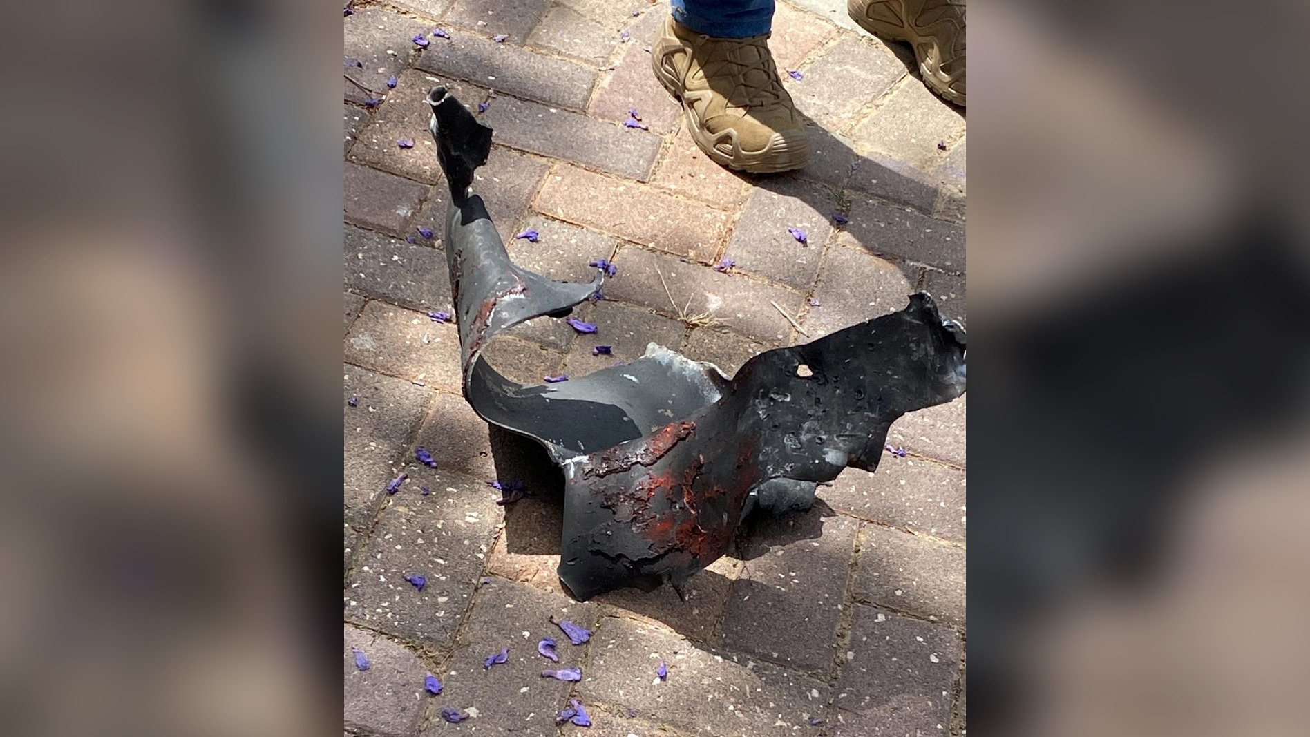 The remains of a rocket fired from Gaza towards Israel lie on the ground in Herzliya, Israel, on May 26. 