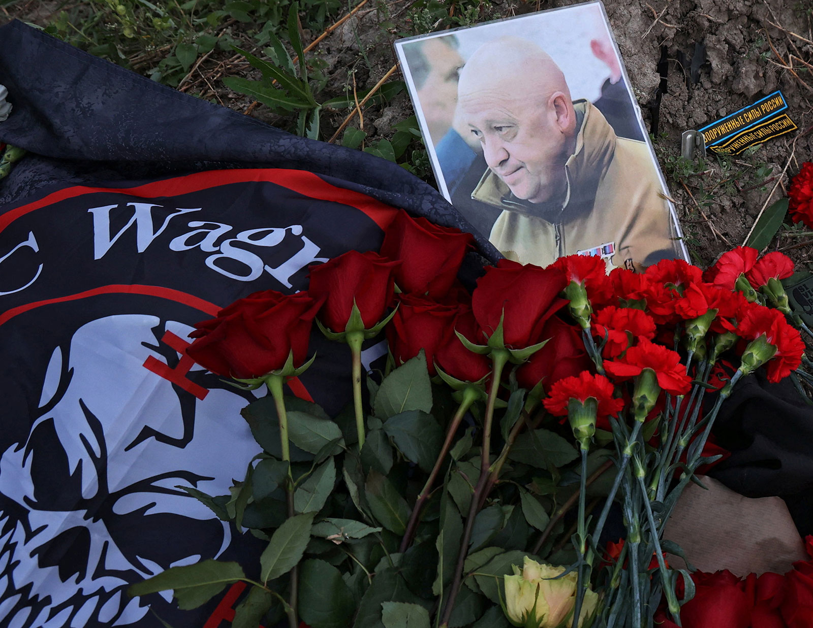 A view shows a portrait of Wagner mercenary chief Yevgeny Prigozhin at a makeshift memorial near former PMC Wagner Centre in Saint Petersburg, Russia August 24.