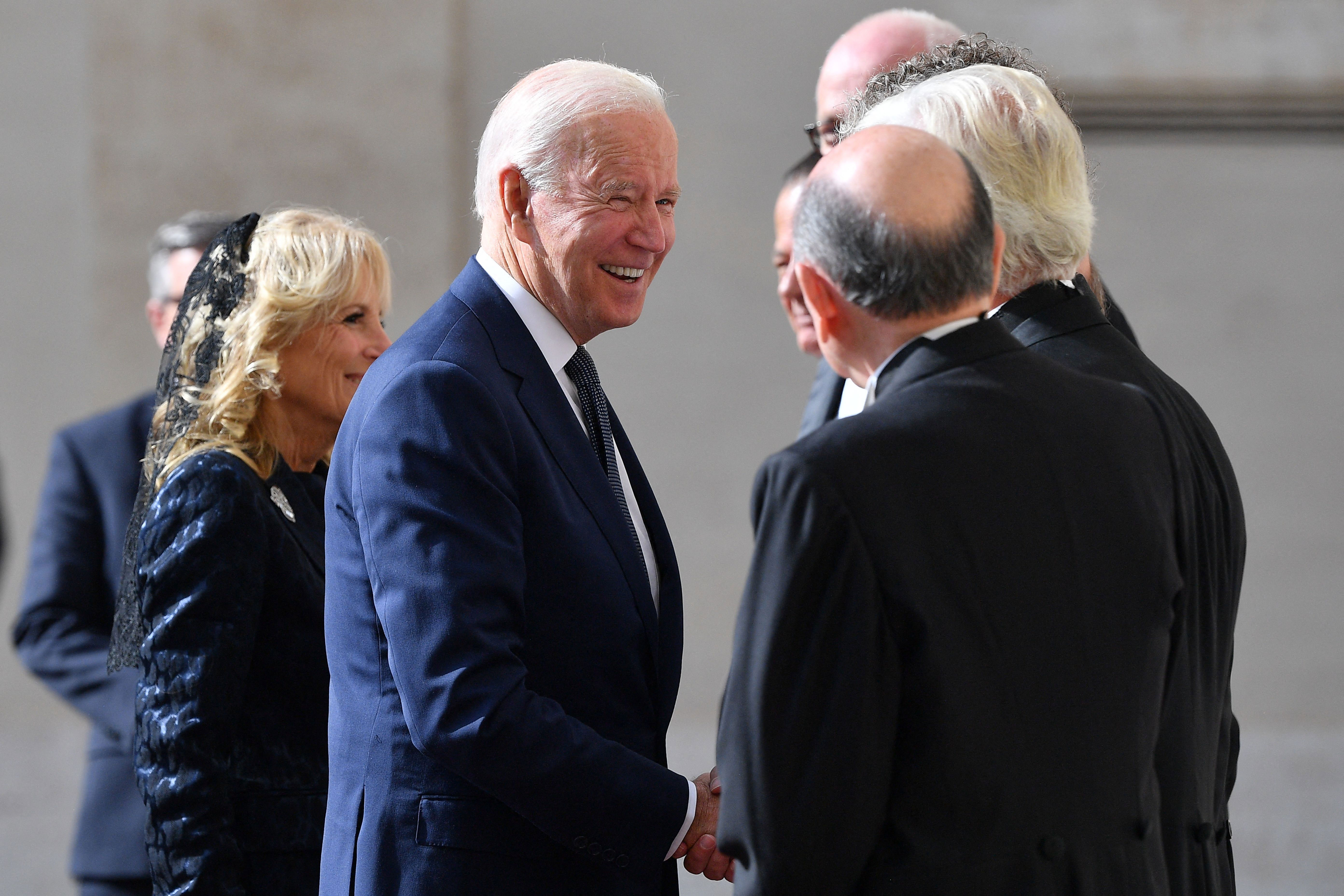 The Pope's gentlemen greet President Joe Biden and first lady Jill Biden as they arrive at San Damaso courtyard in the Vatican on October 29.
