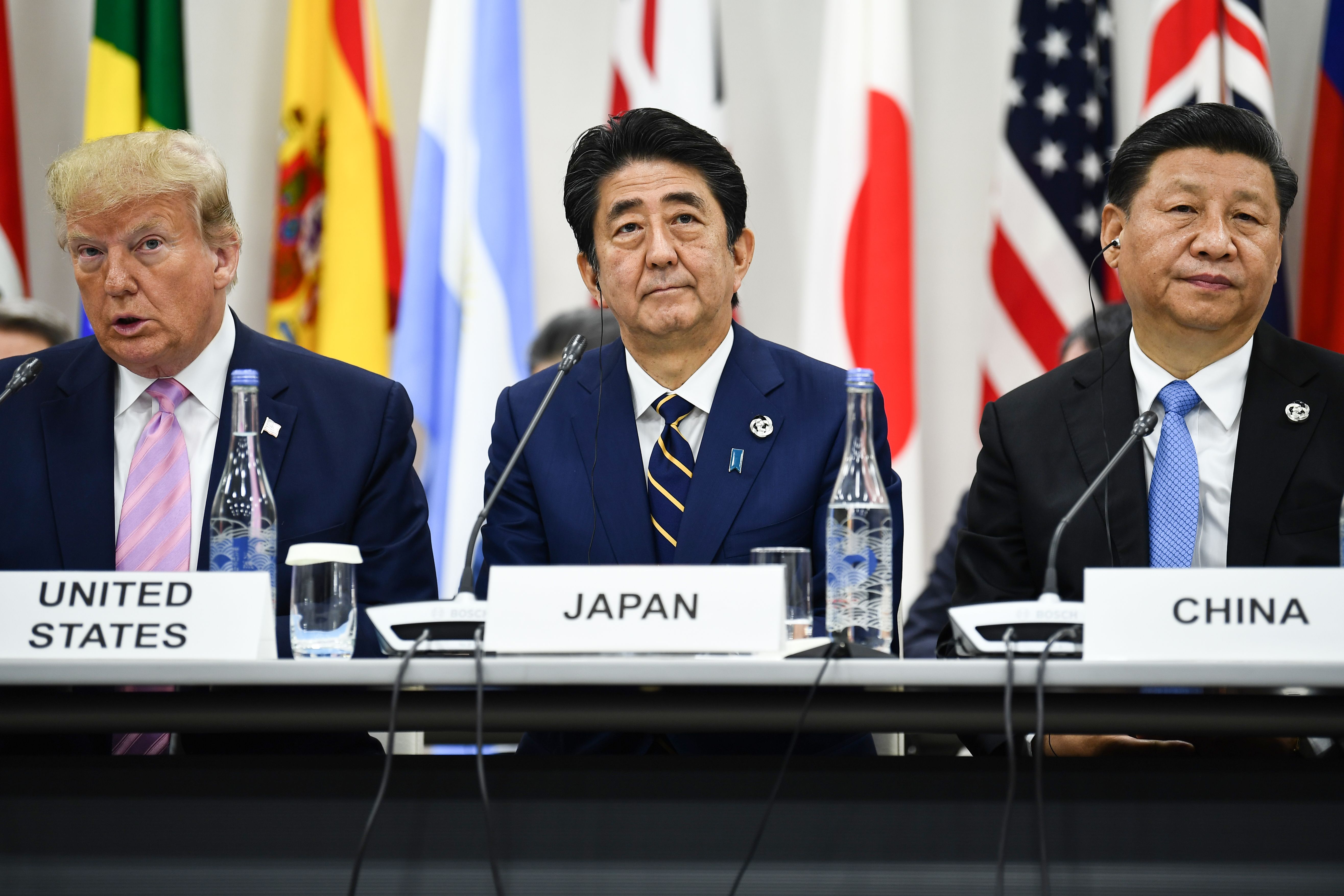 US President Donald Trump, Japan's Prime Minister Shinzo Abe and China's President Xi Jinping attend a meeting at the G20 Summit in Osaka on June 28.
