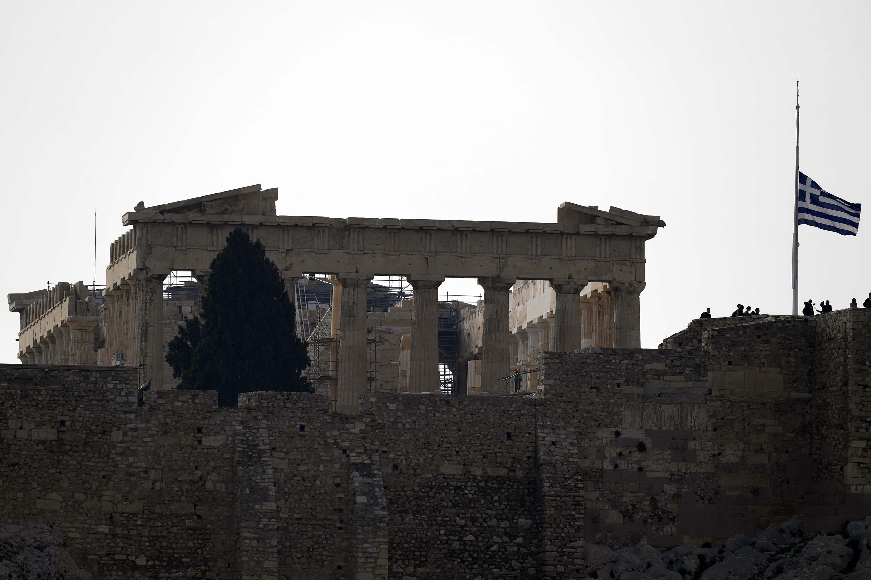 A flag at the Acropolis flies at half-mast in Athens, Greece, on Wednesday, March 1.