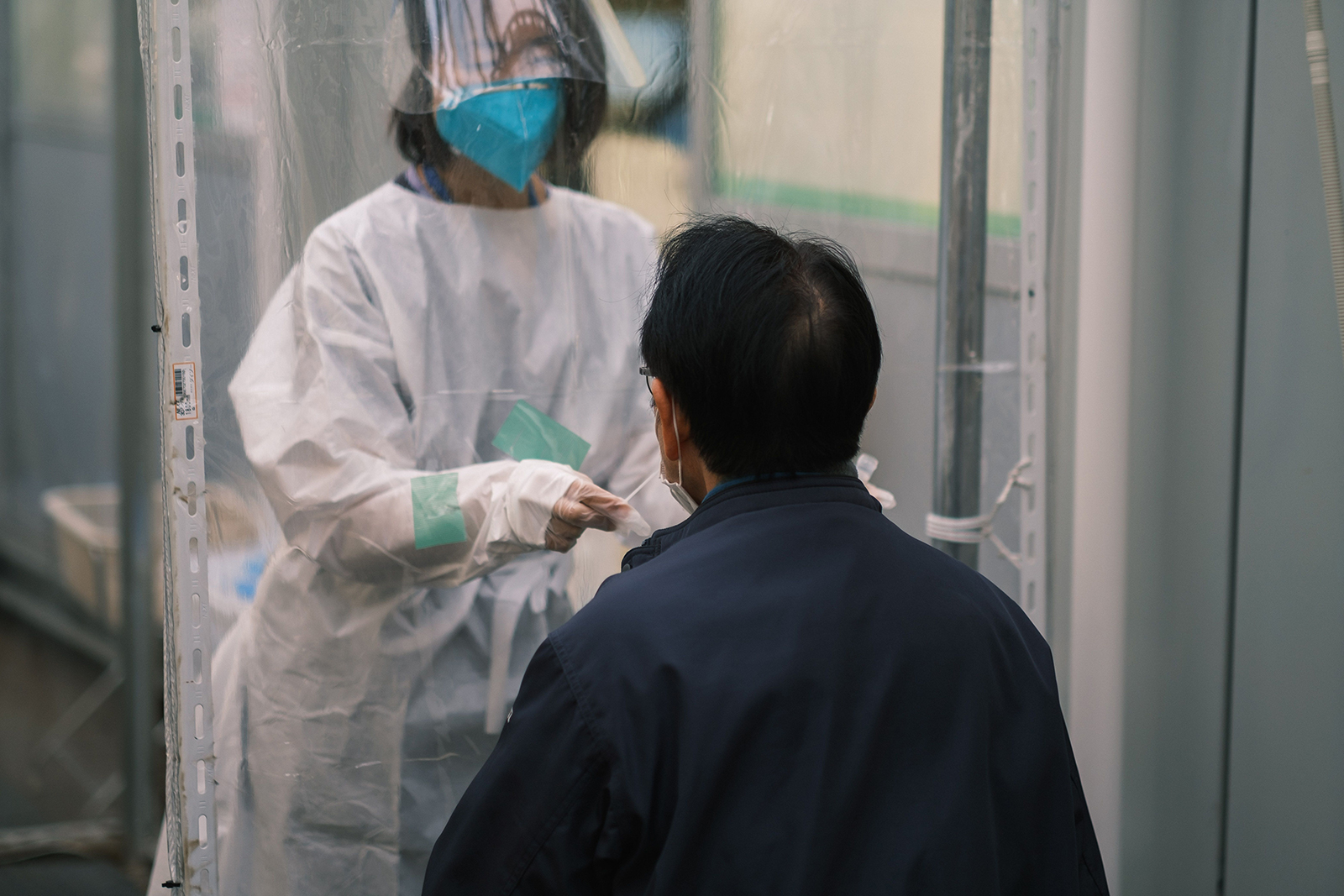 A nurse collects a nasal swab sample at a Covid-19 testing center at Fujimino Emergency Hospital in Miyoshi-machi, Japan on January 5.